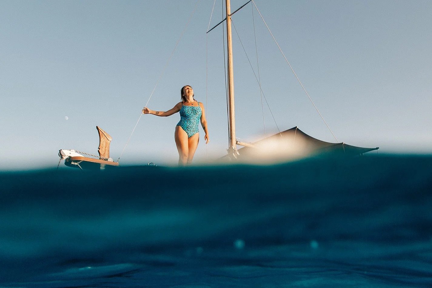Person watching the sunset on a boat in Menorca