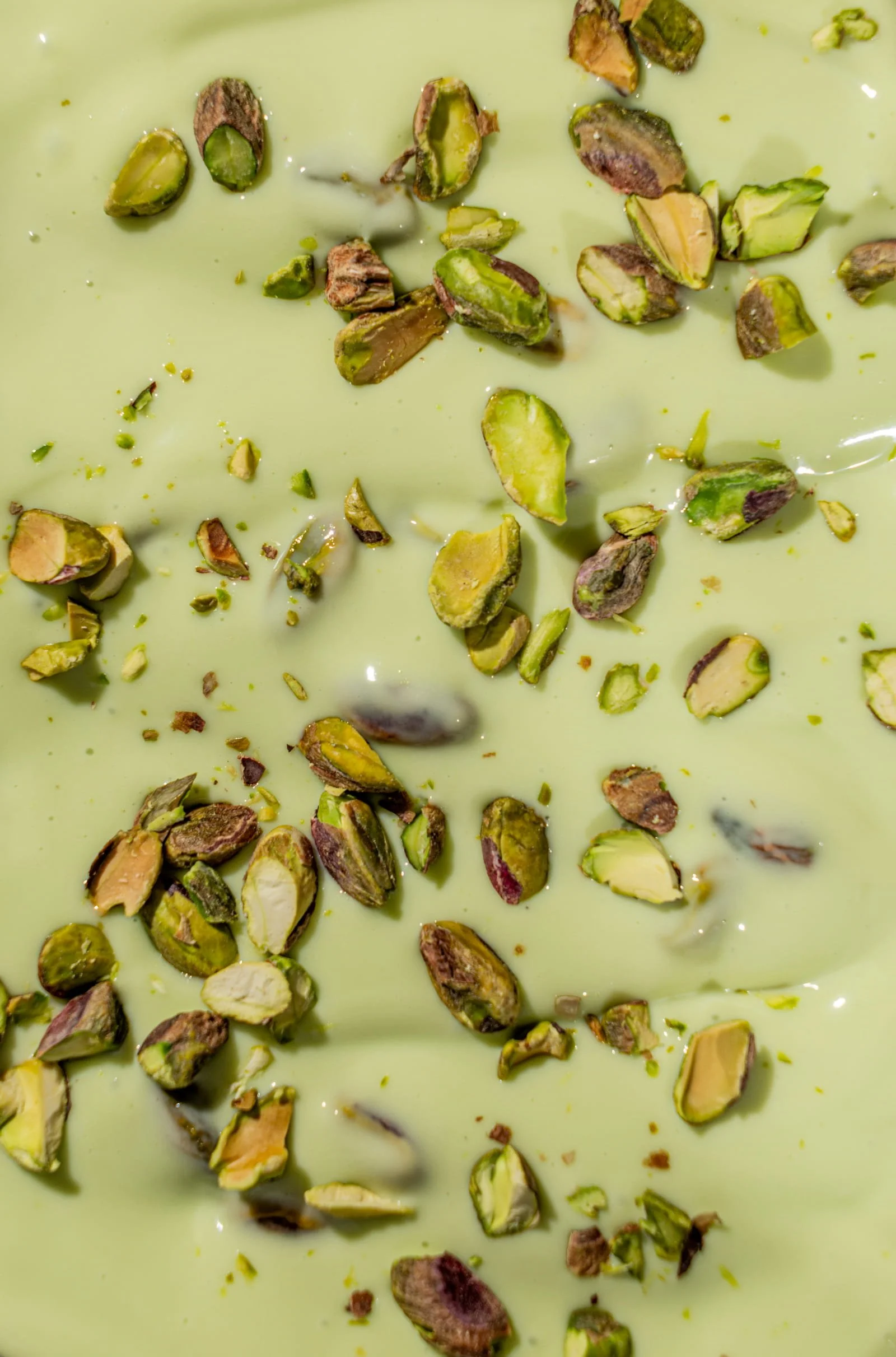 Close-up of chopped pistachios in a creamy pistachio cream.