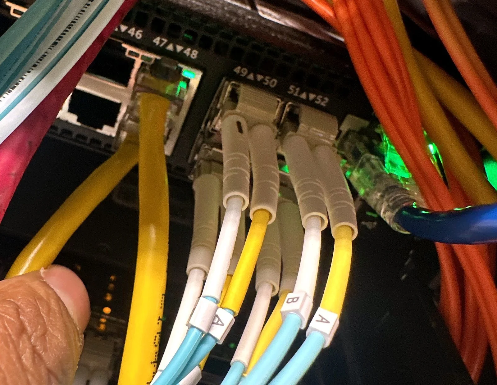 LC fiber jumpers being patched into a switch