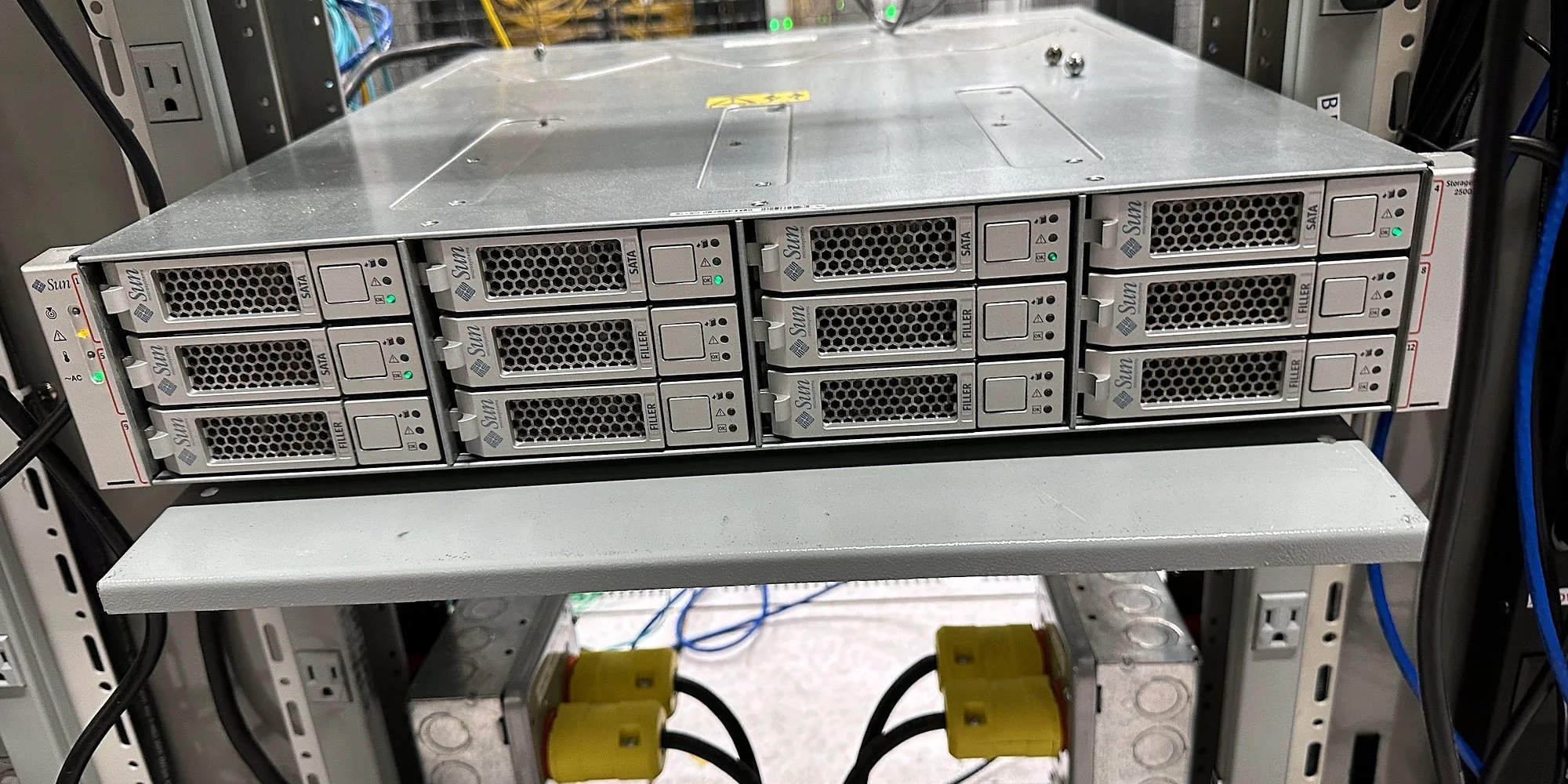 Storage array with hot-swap drives racked in a data center