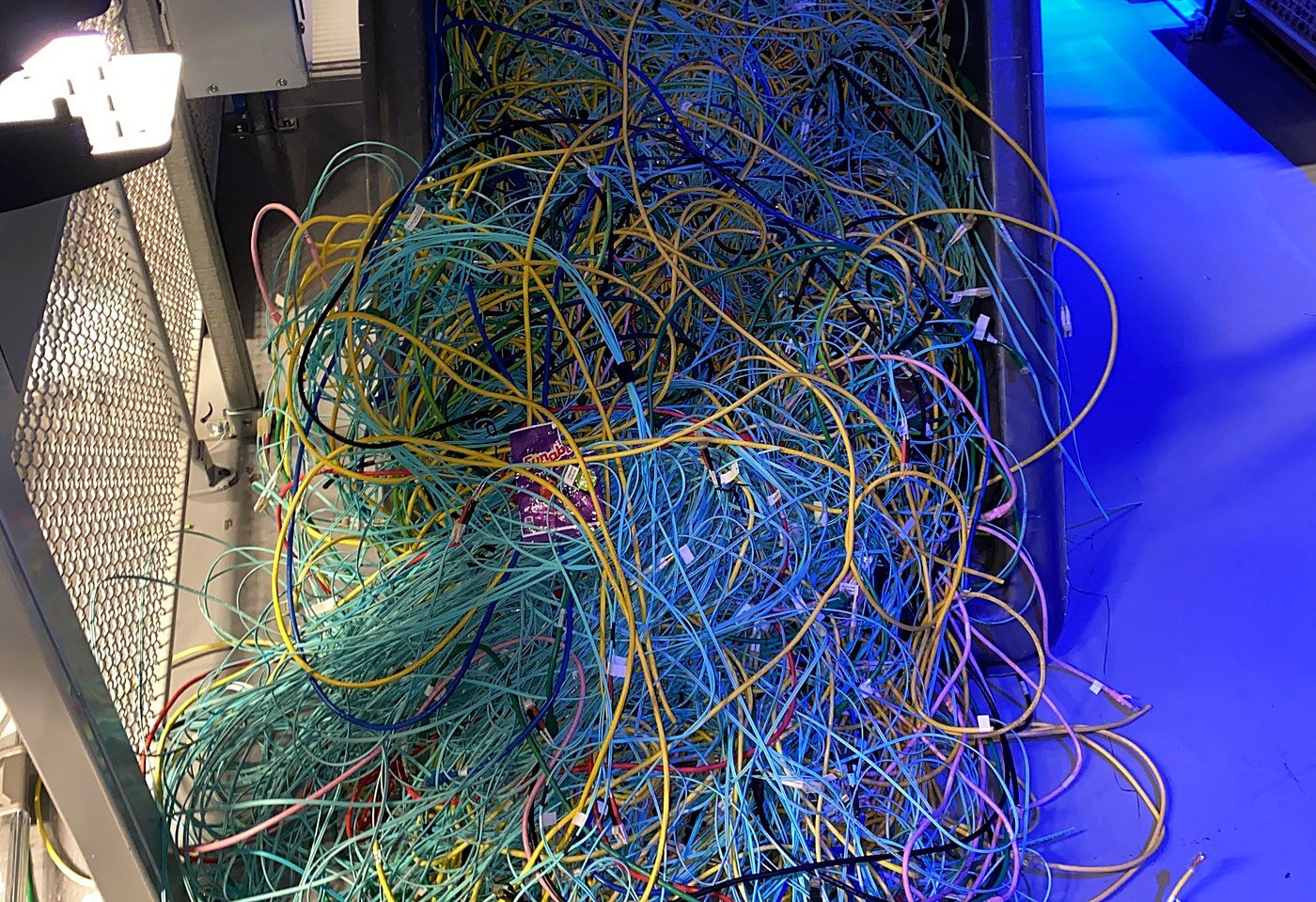 Abandoned fiber and copper patch cables pulled out of a data center cabinet during cleanup