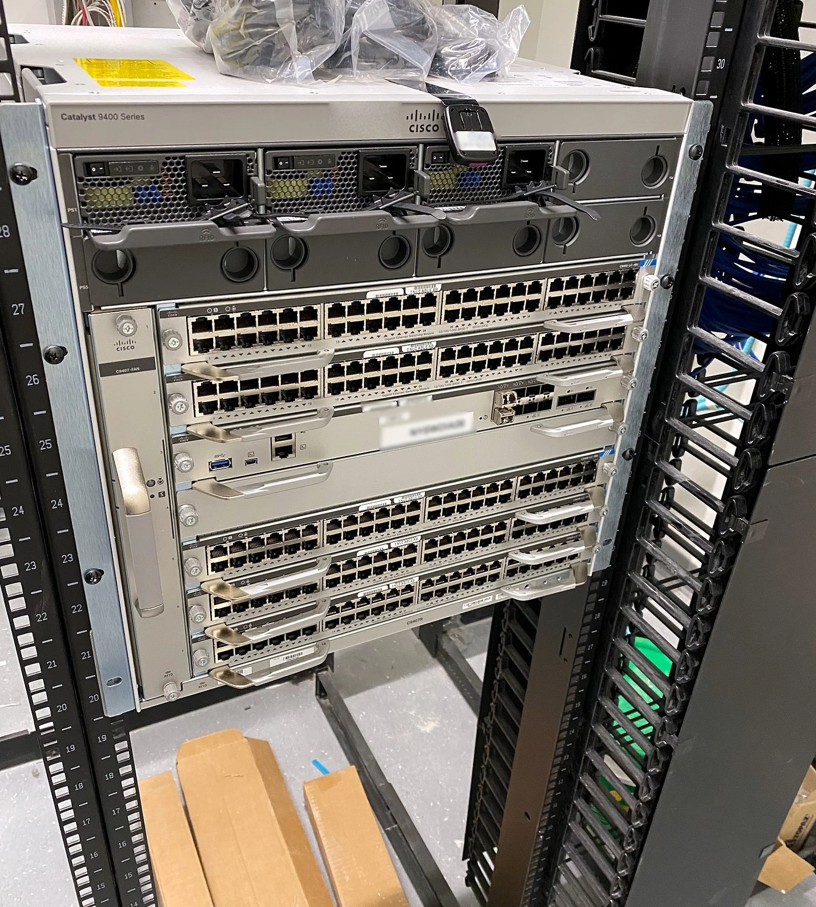 Network chassis stacked in a two-post rack