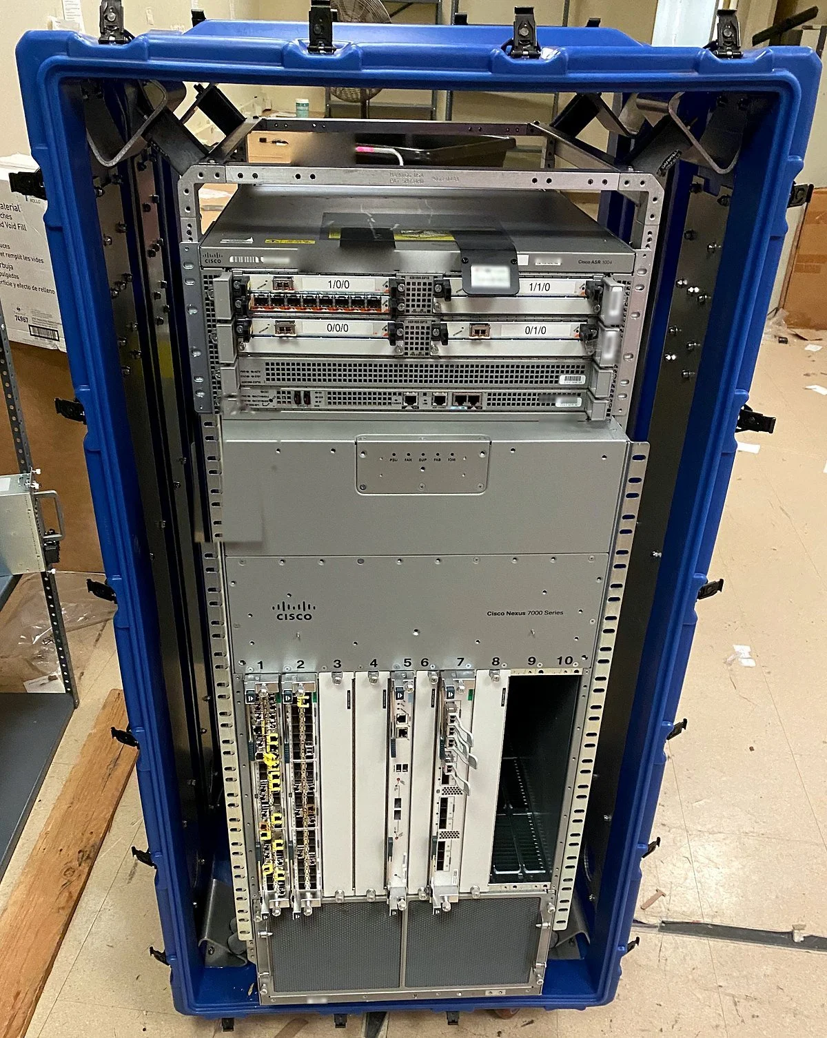 Decommissioned Cisco Nexus 7000 and ASR 1004 secured in a shipping case for removal