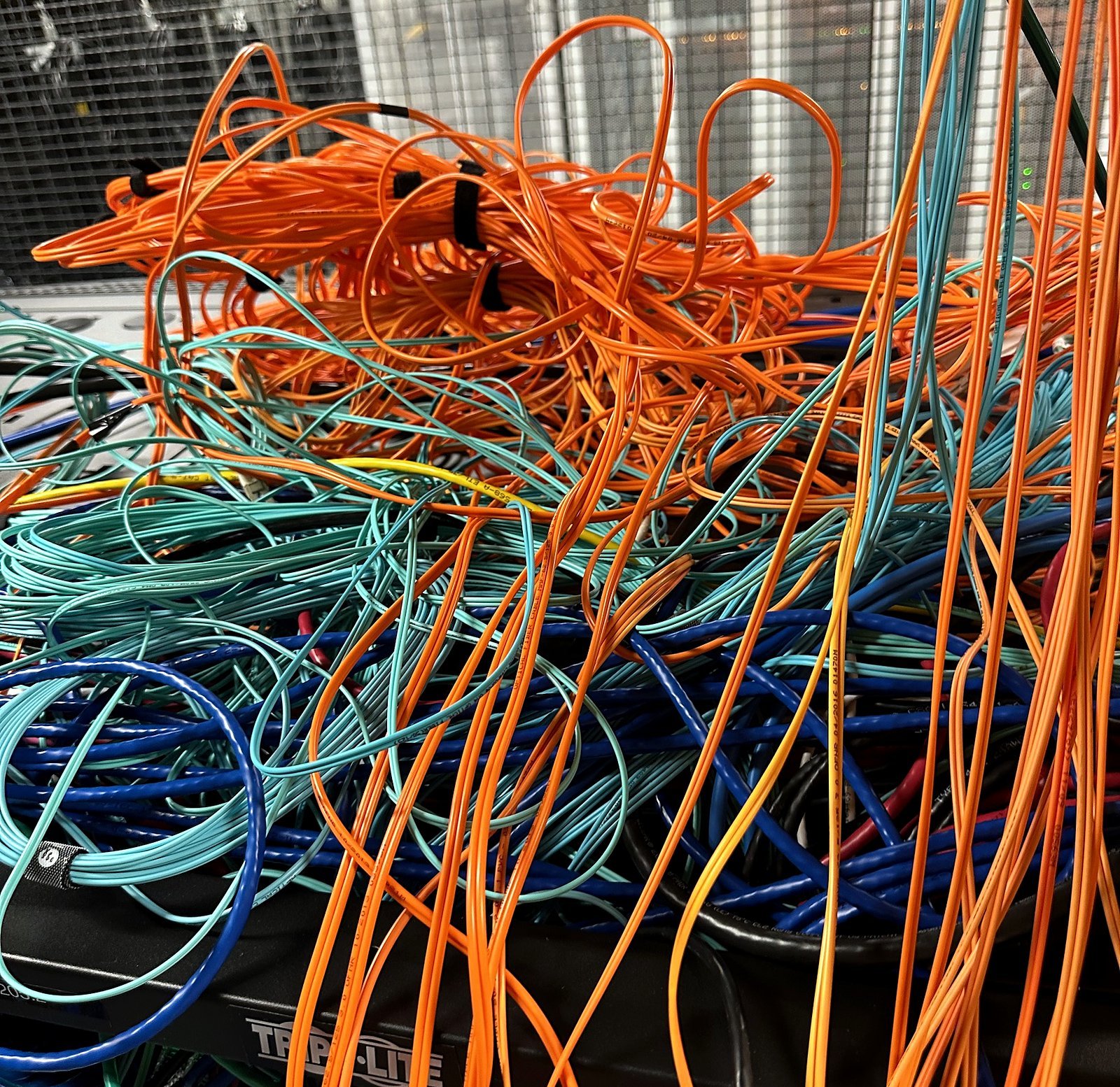 Abandoned orange and aqua fiber pulled out of cabinets during a cleanup