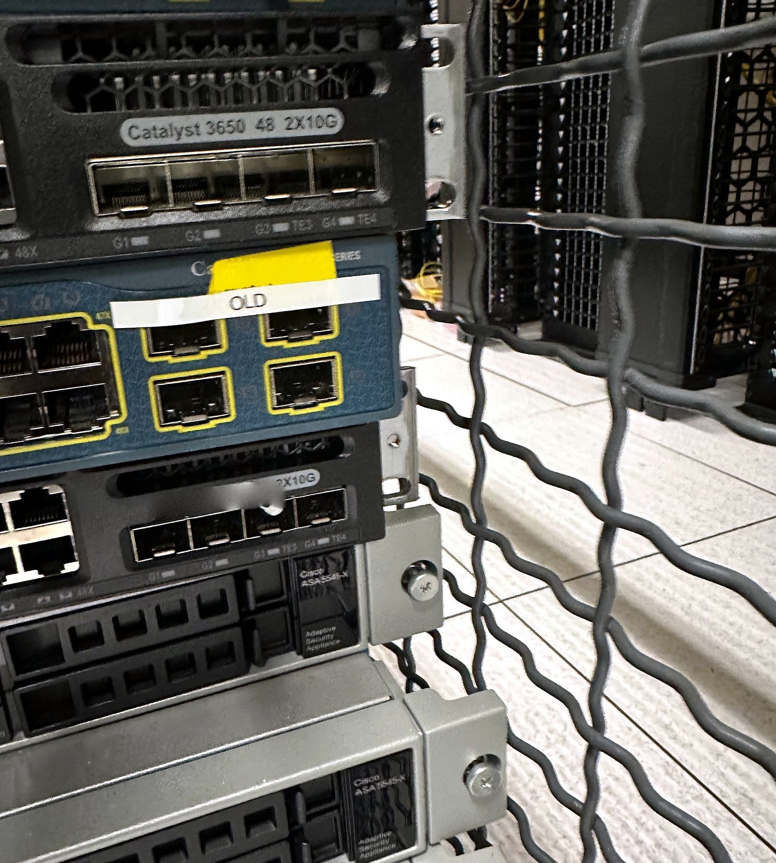 Network switches racked inside a colocation cage