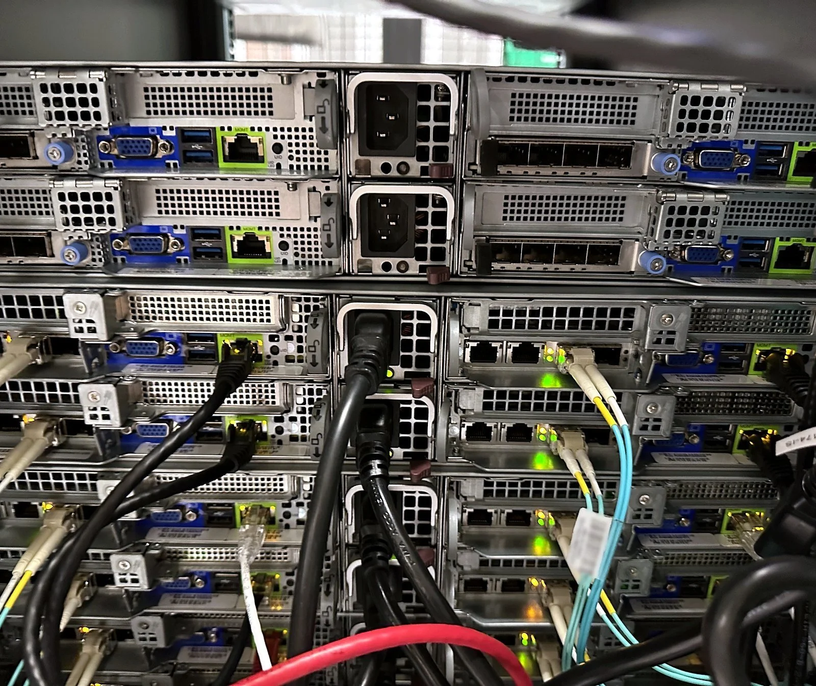 Rear of rack-mounted servers with power and network cabling dressed
