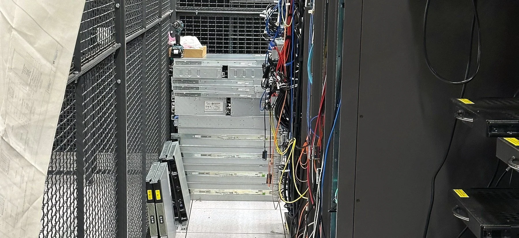 Colocation cage aisle staged for a data center move