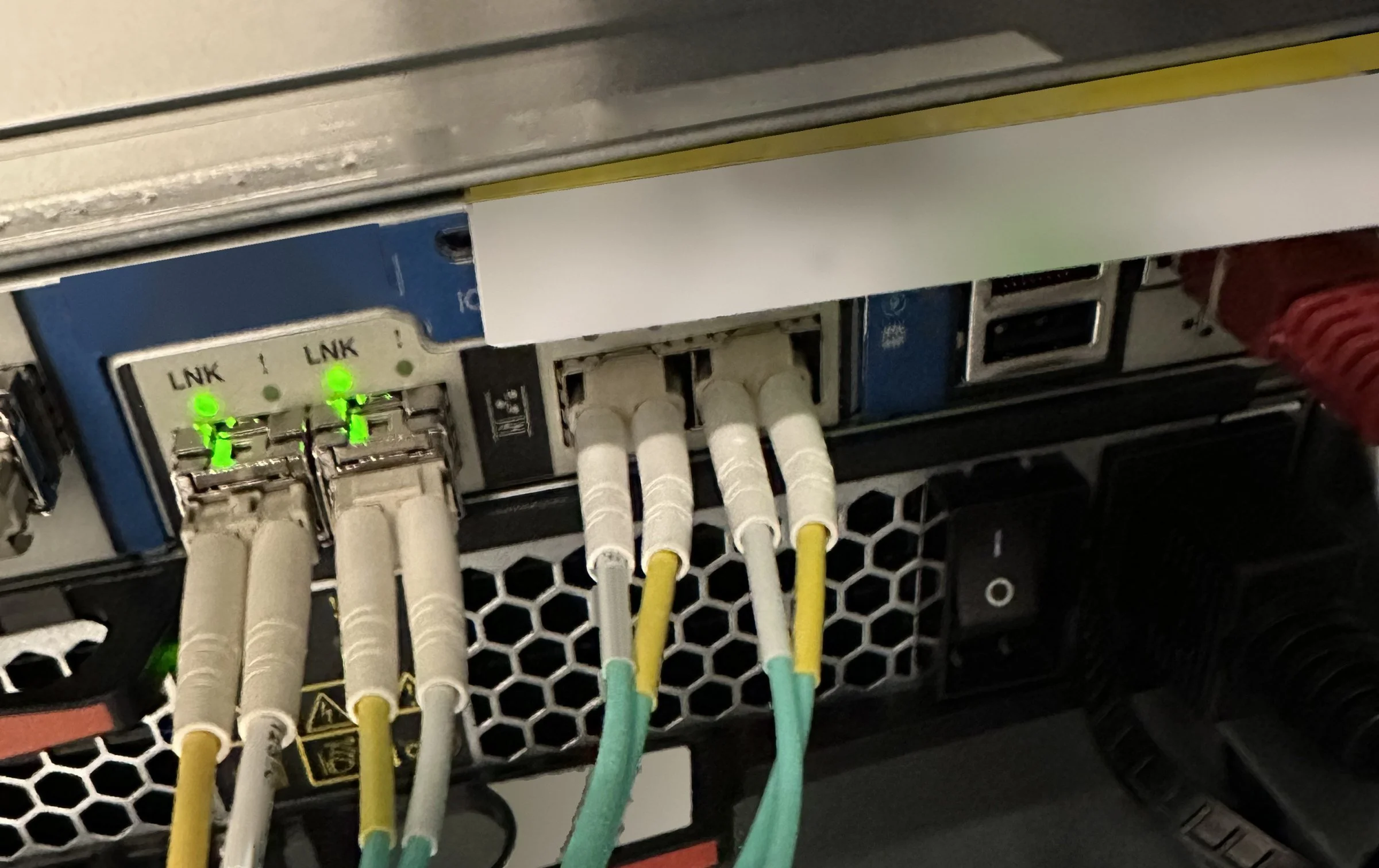 Aqua multimode fiber connected to NetApp storage controller ports, Center City Philadelphia job