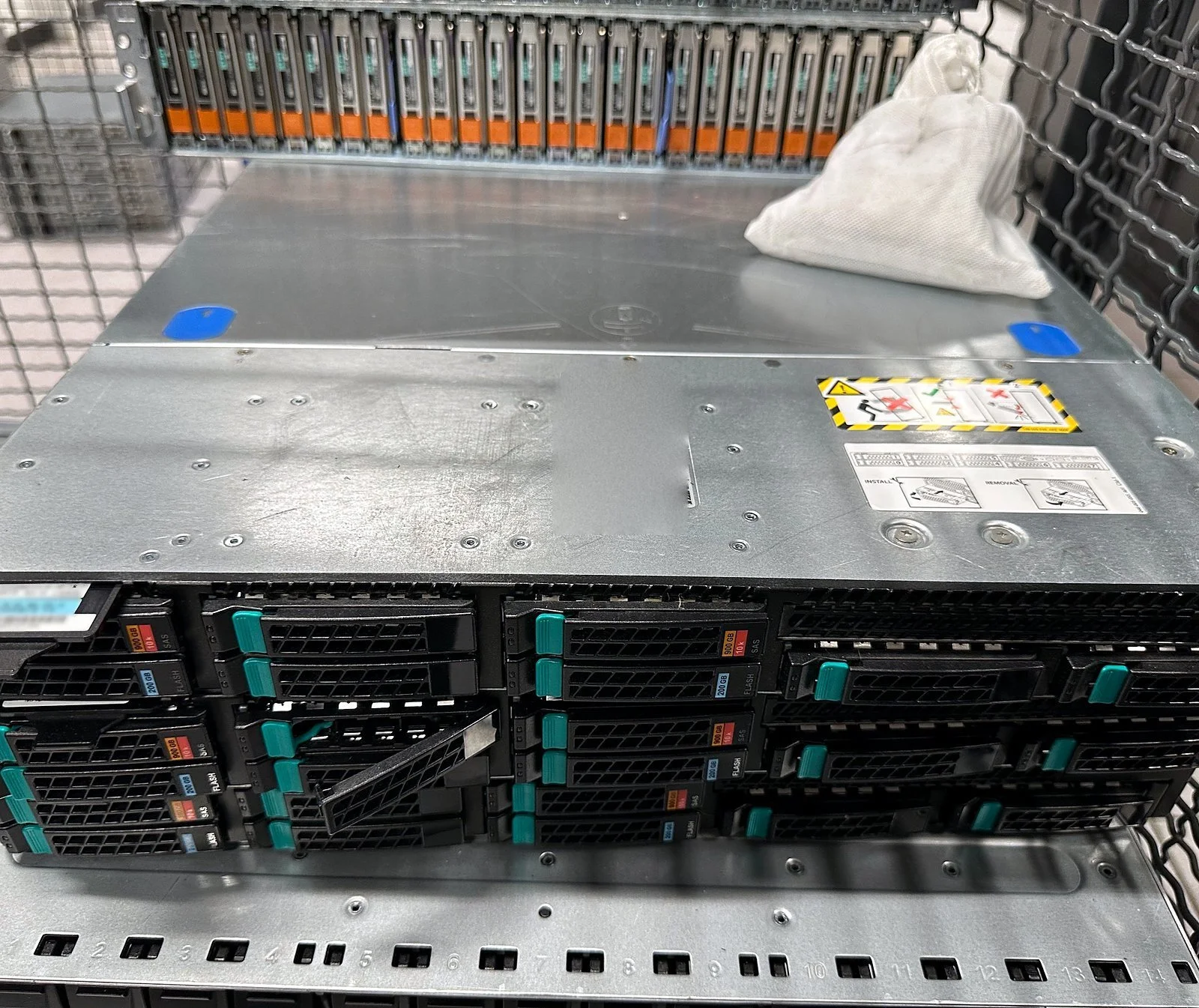 Decommissioned storage arrays stacked for removal