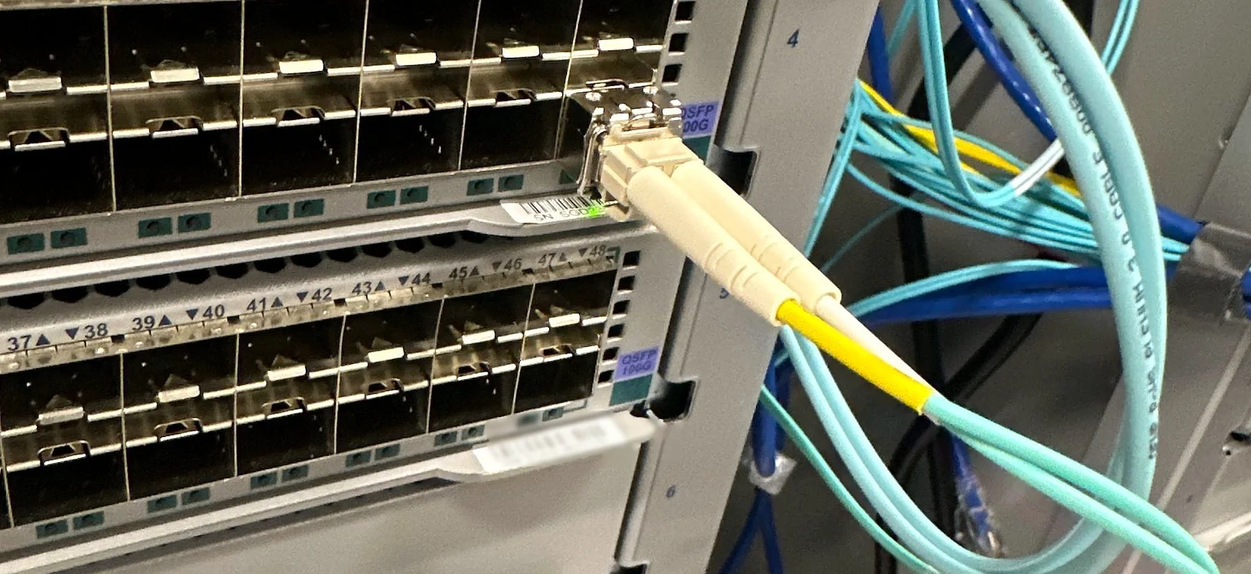 Switch line card patched with aqua multimode fiber