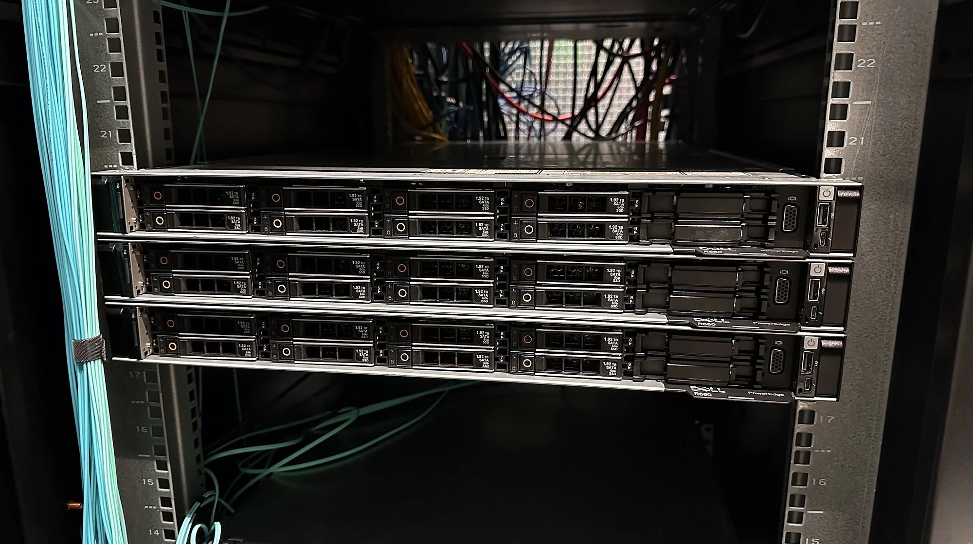 Storage enclosures racked in a data center cabinet