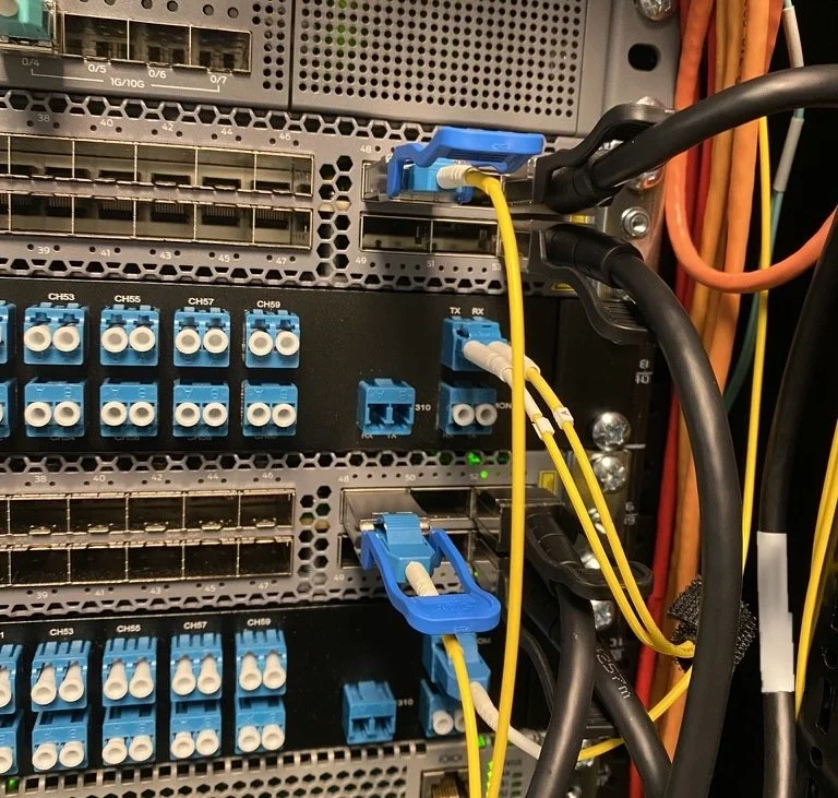 CWDM mux shelves with LC fiber patched to switch optics in a network rack