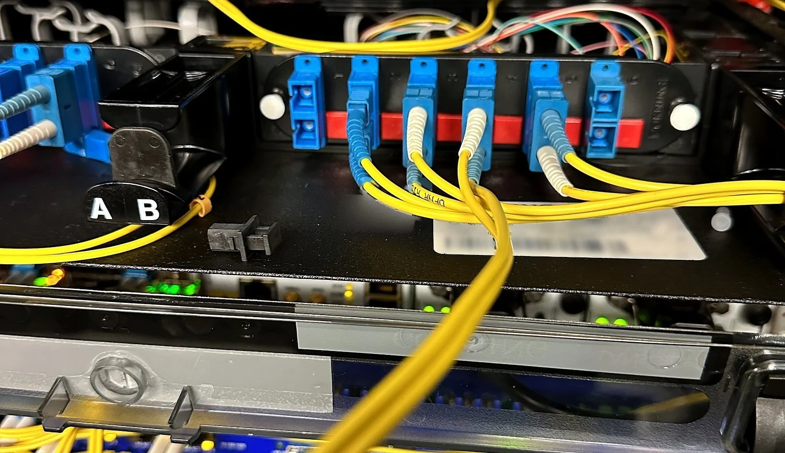 Fiber cassettes patched with yellow single-mode jumpers