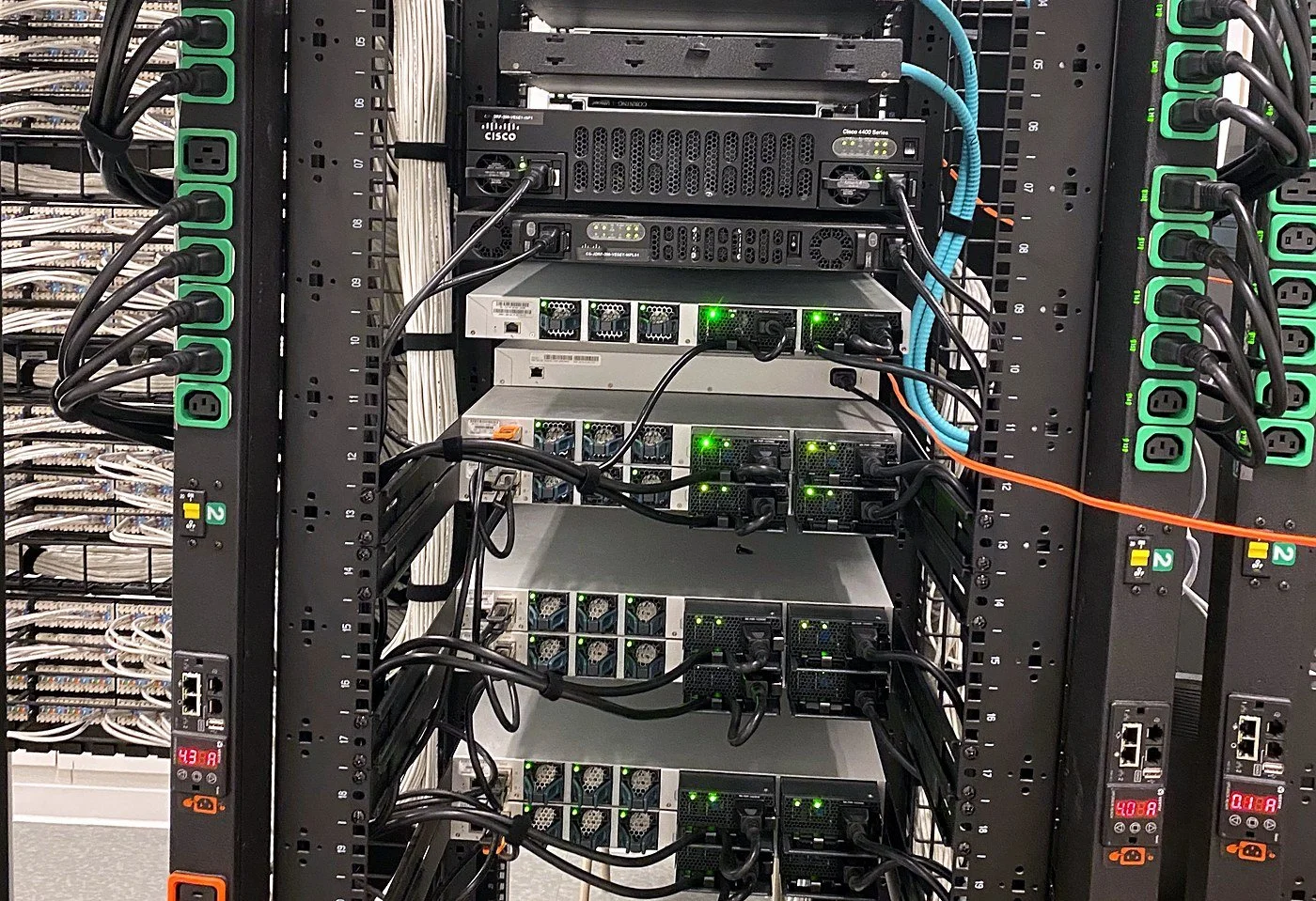 Cisco switches racked and powered from A and B PDUs in a data center cabinet