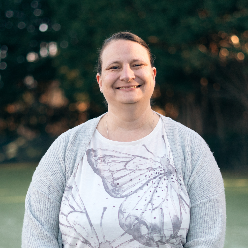 Repeated text 'Coming Soon' in various shades of pink on a red background.