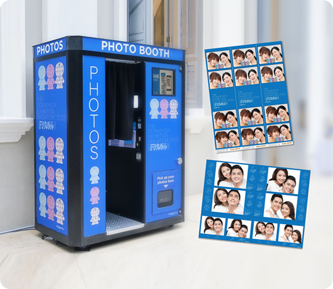 A blue PHOTO BOOTH with graphic characters and black curtain, shown with two example blue-themed photo print strips