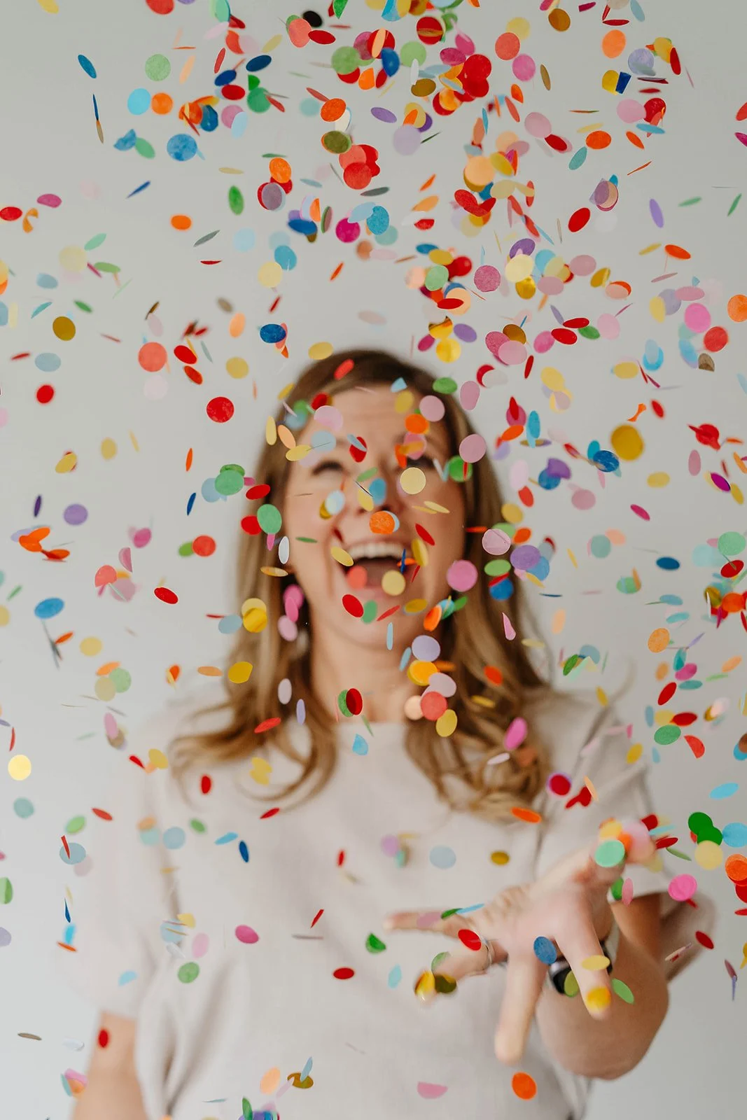 April throwing confetti