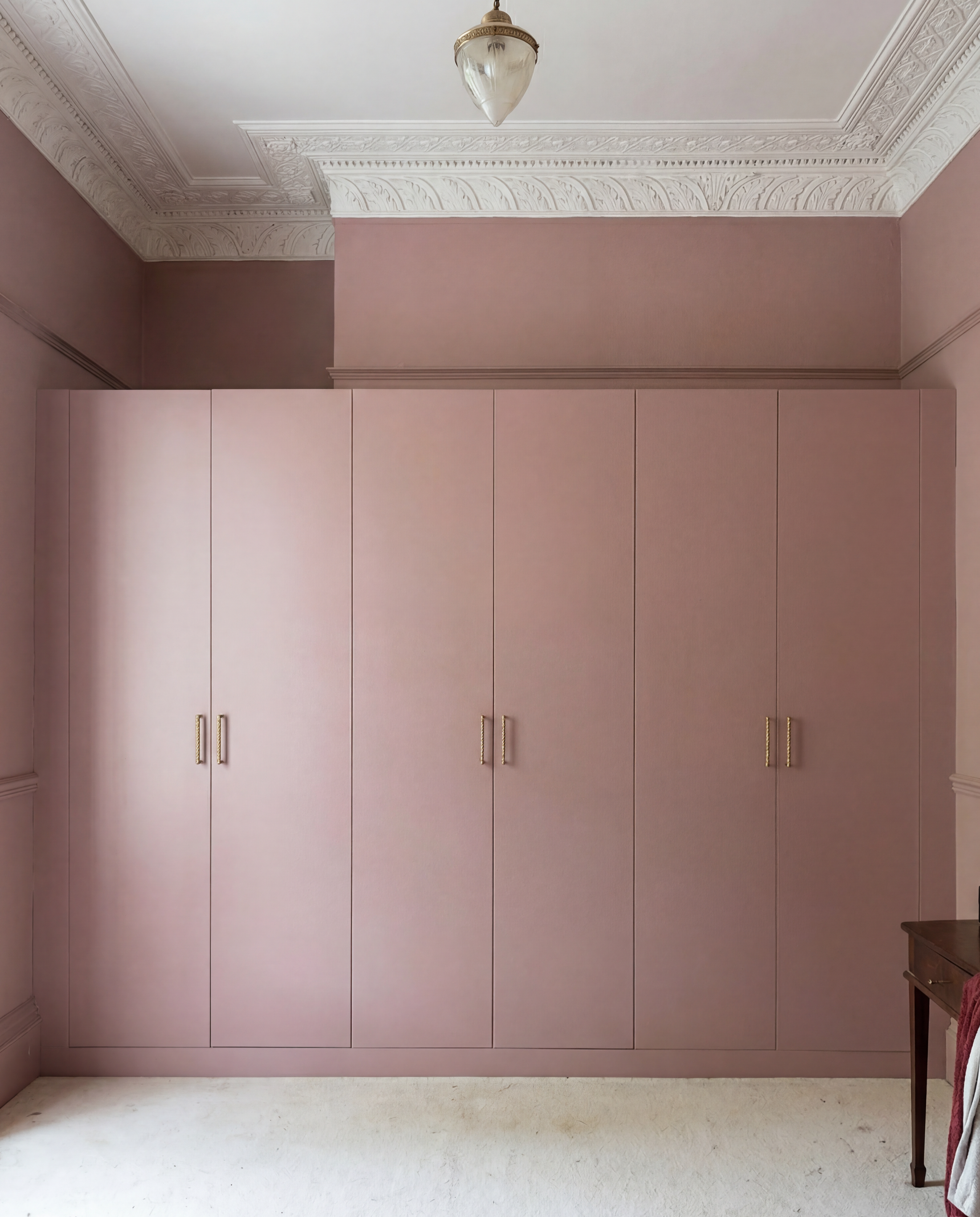“Bespoke fitted wardrobes with slab doors in a period Bath home”