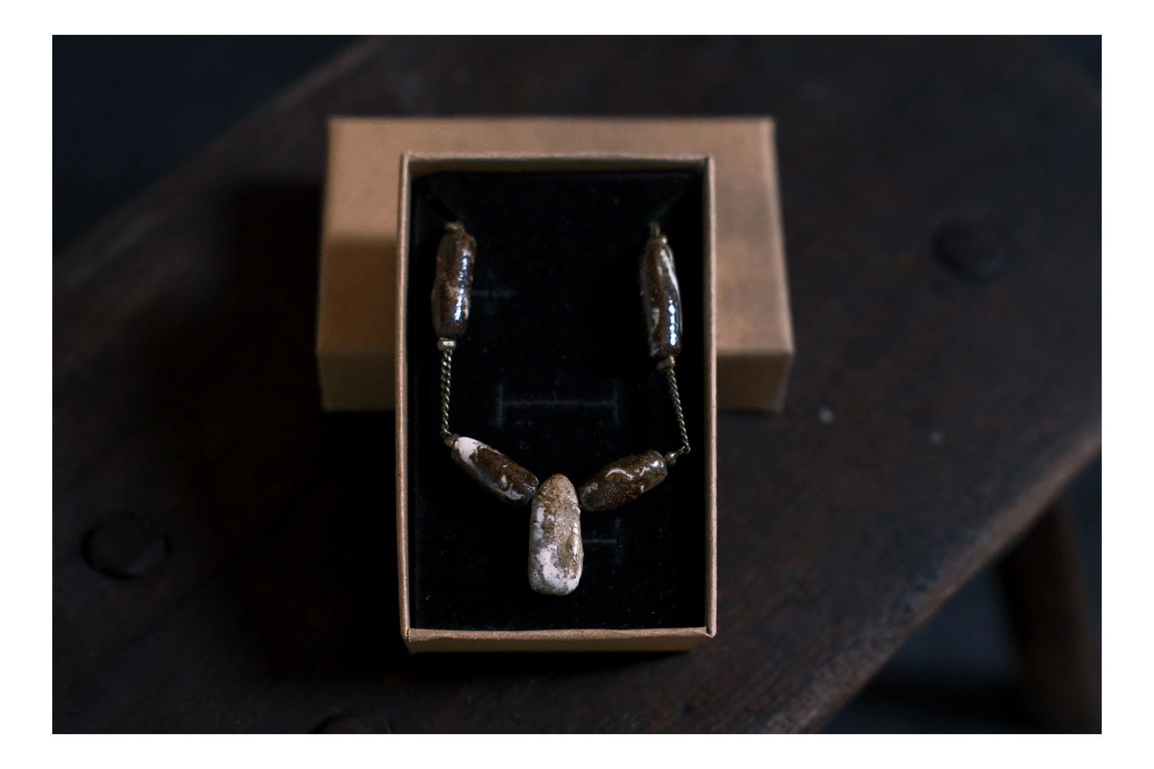 An image of Hand made ceramic necklace.