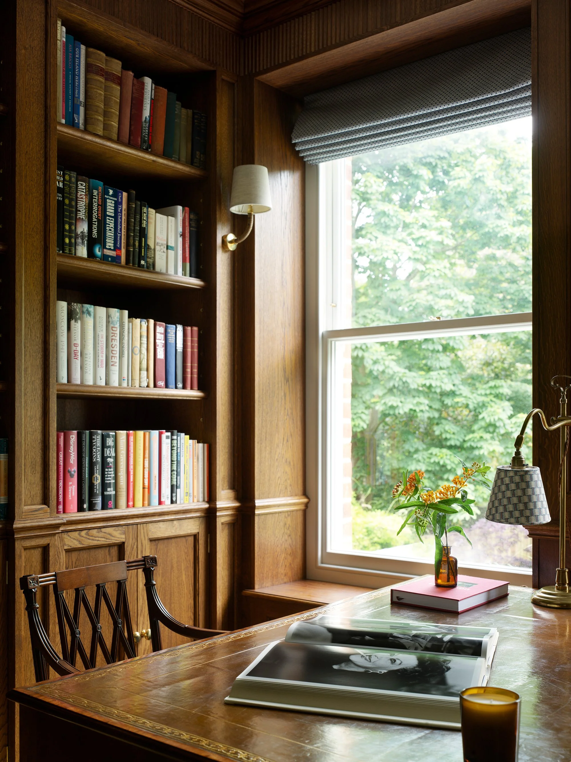 Open bookshelves and bespoke cabinetry in a study by Greenstreet Furniture