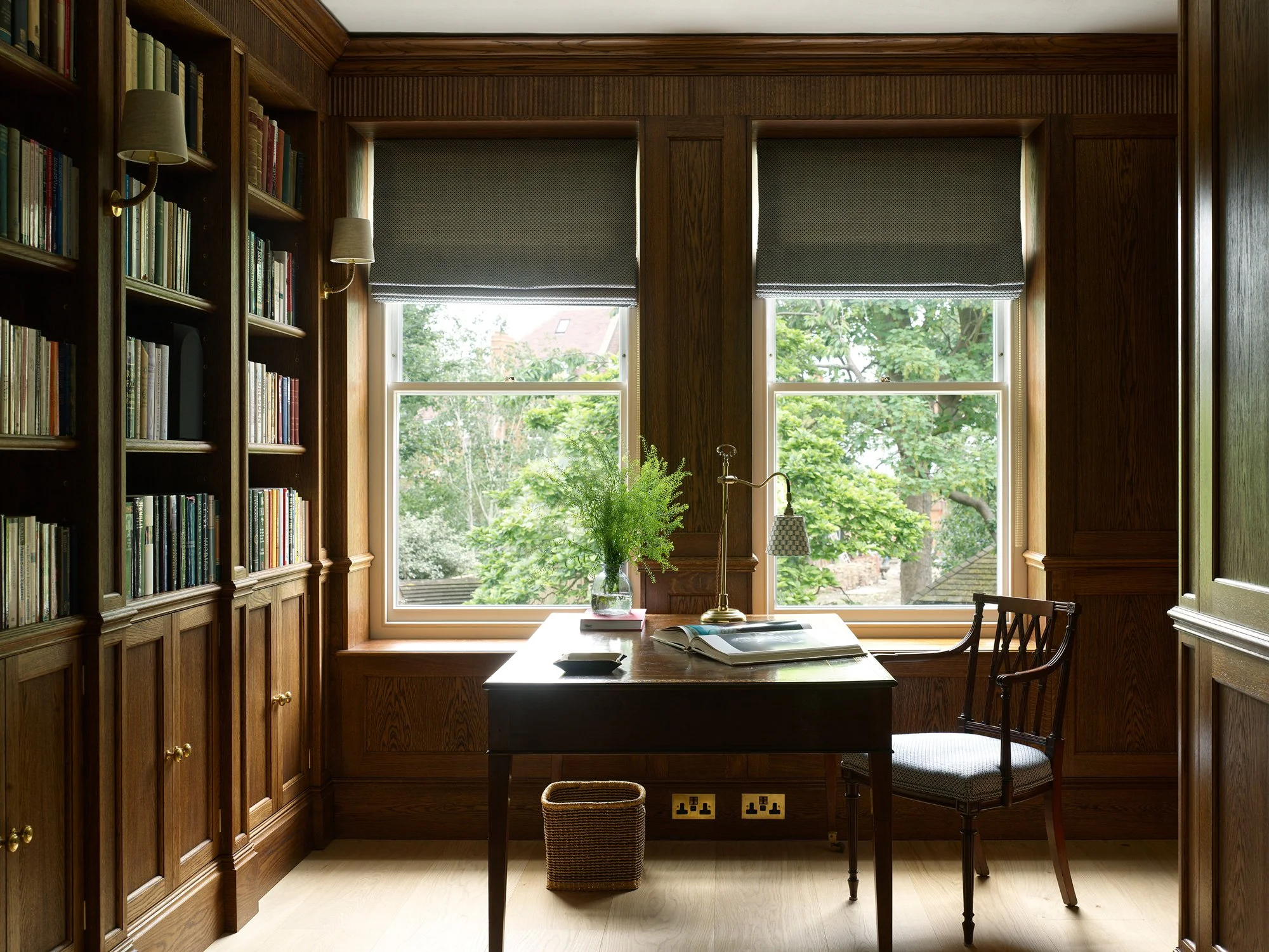 Open bookshelves and bespoke cabinetry in a study by Greenstreet Furniture