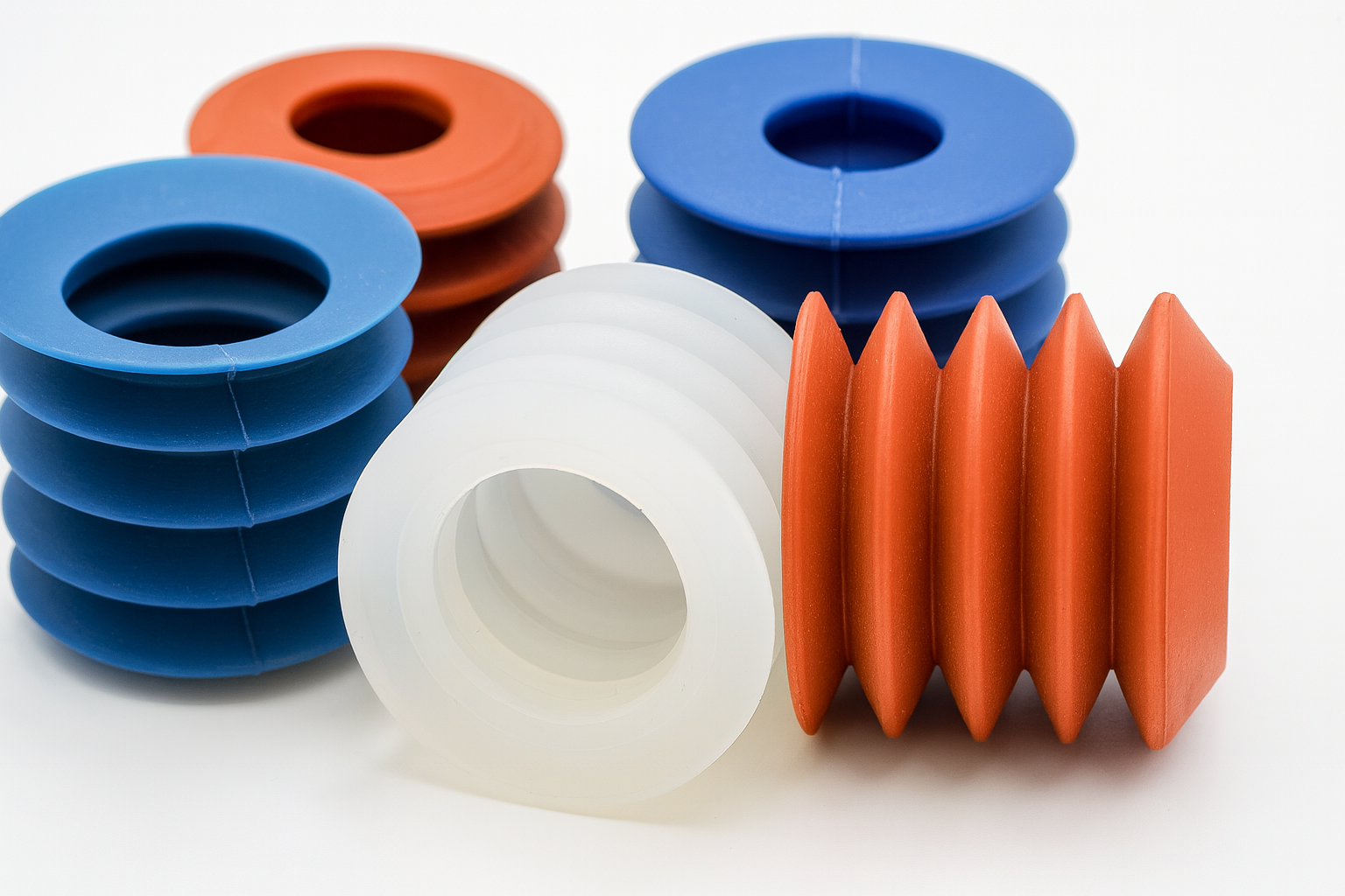 Orange, Blue and White depanner cups arranged on a white background.