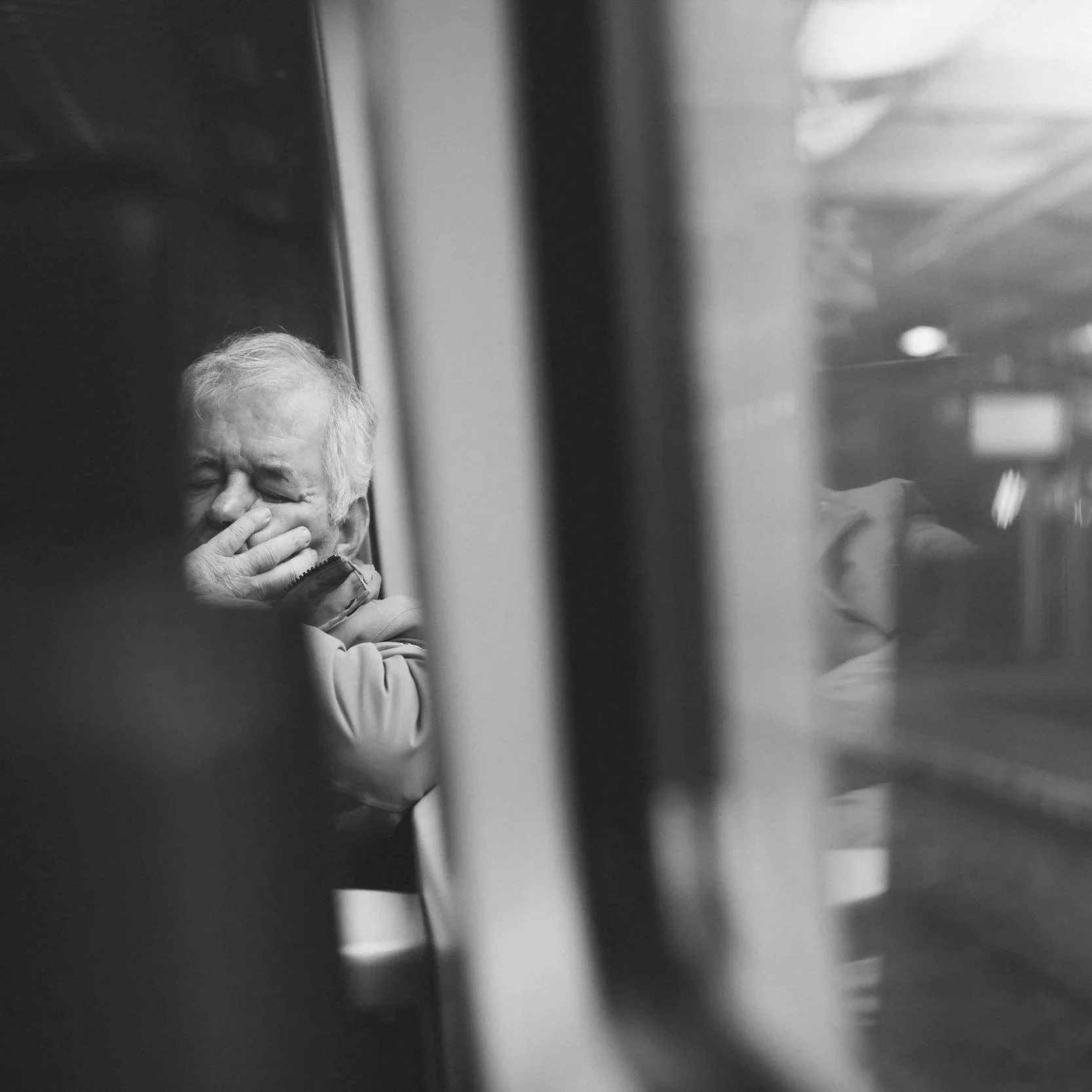 Geometric drawing of an outline square with sections divided by vertical, horizontal, and diagonal lines.