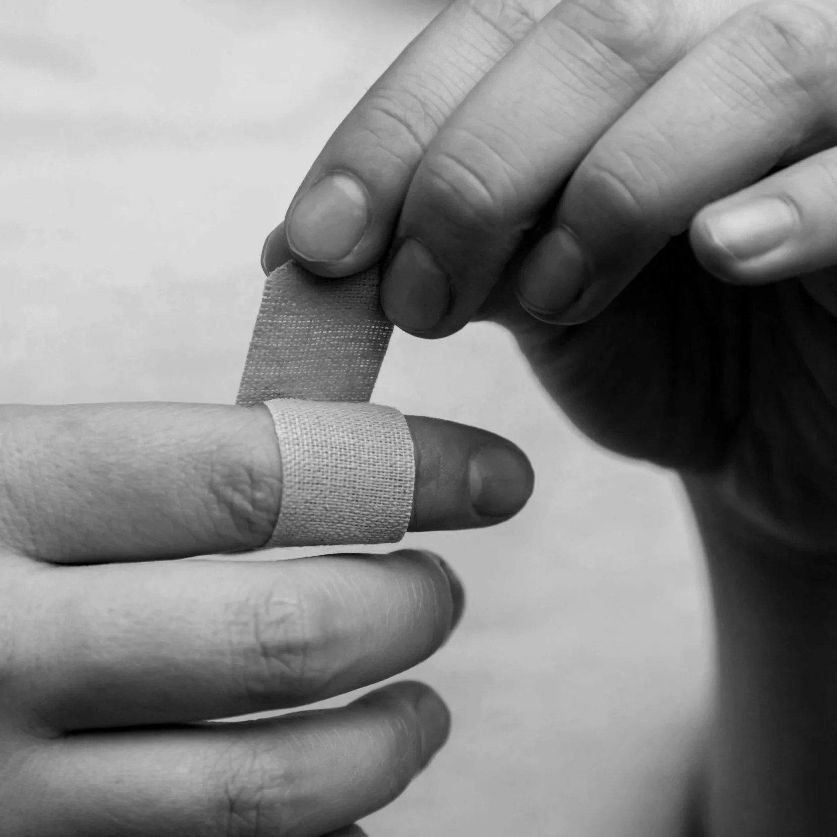 Geometric drawing of an outline square with sections divided by vertical, horizontal, and diagonal lines.