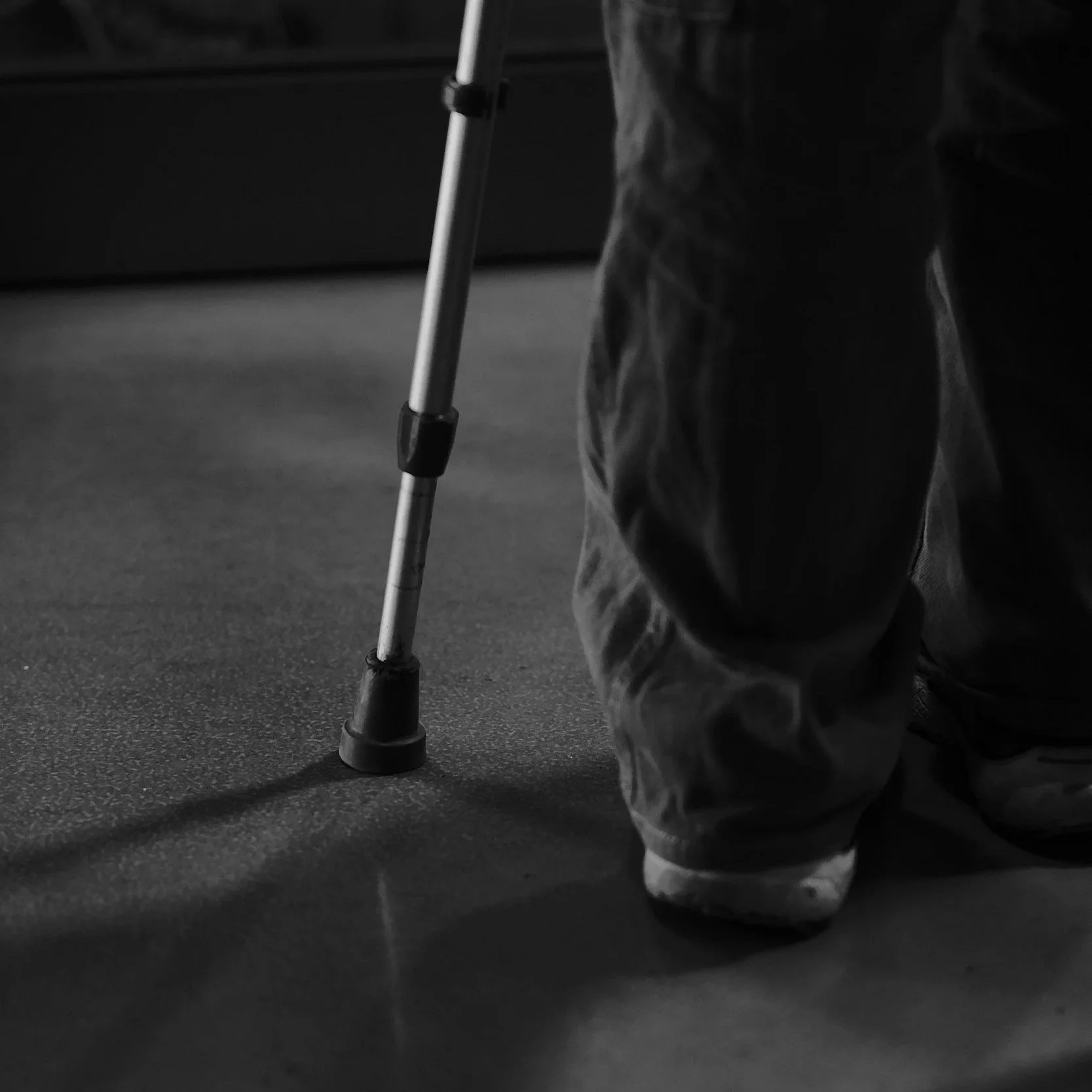 Geometric drawing of an outline square with sections divided by vertical, horizontal, and half circle lines.