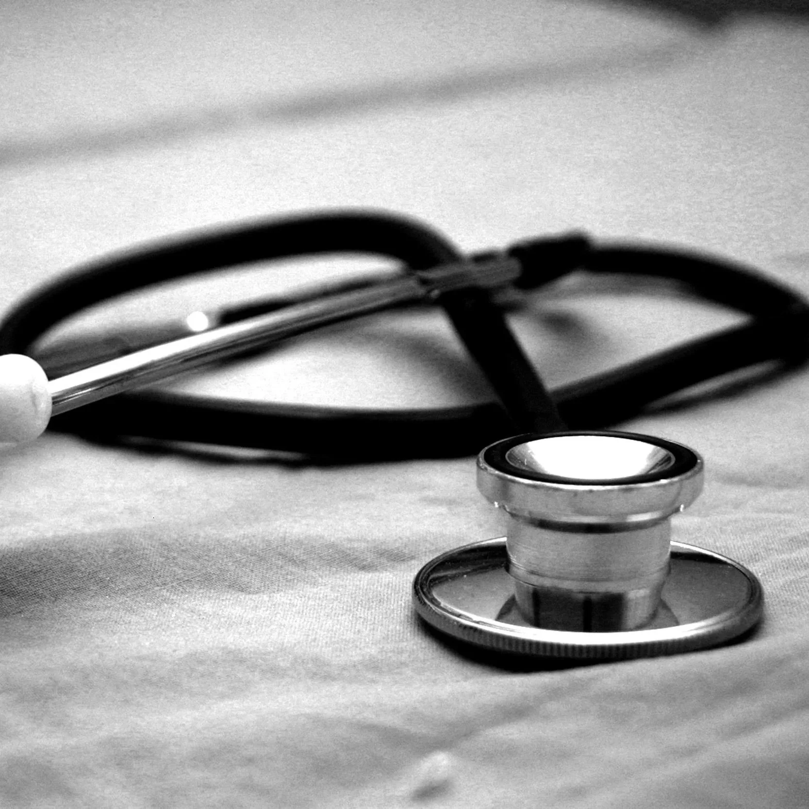 Geometric drawing of an outline square with sections divided by vertical, horizontal, and half circle lines.