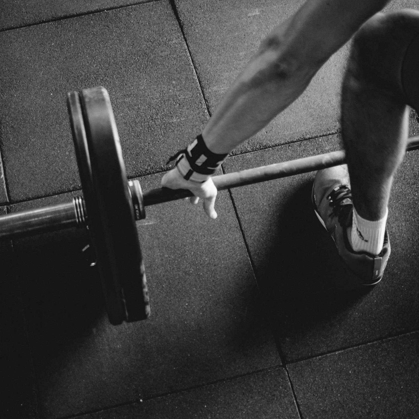 Geometric drawing of an outline square with sections divided by vertical, horizontal, and diagonal lines.