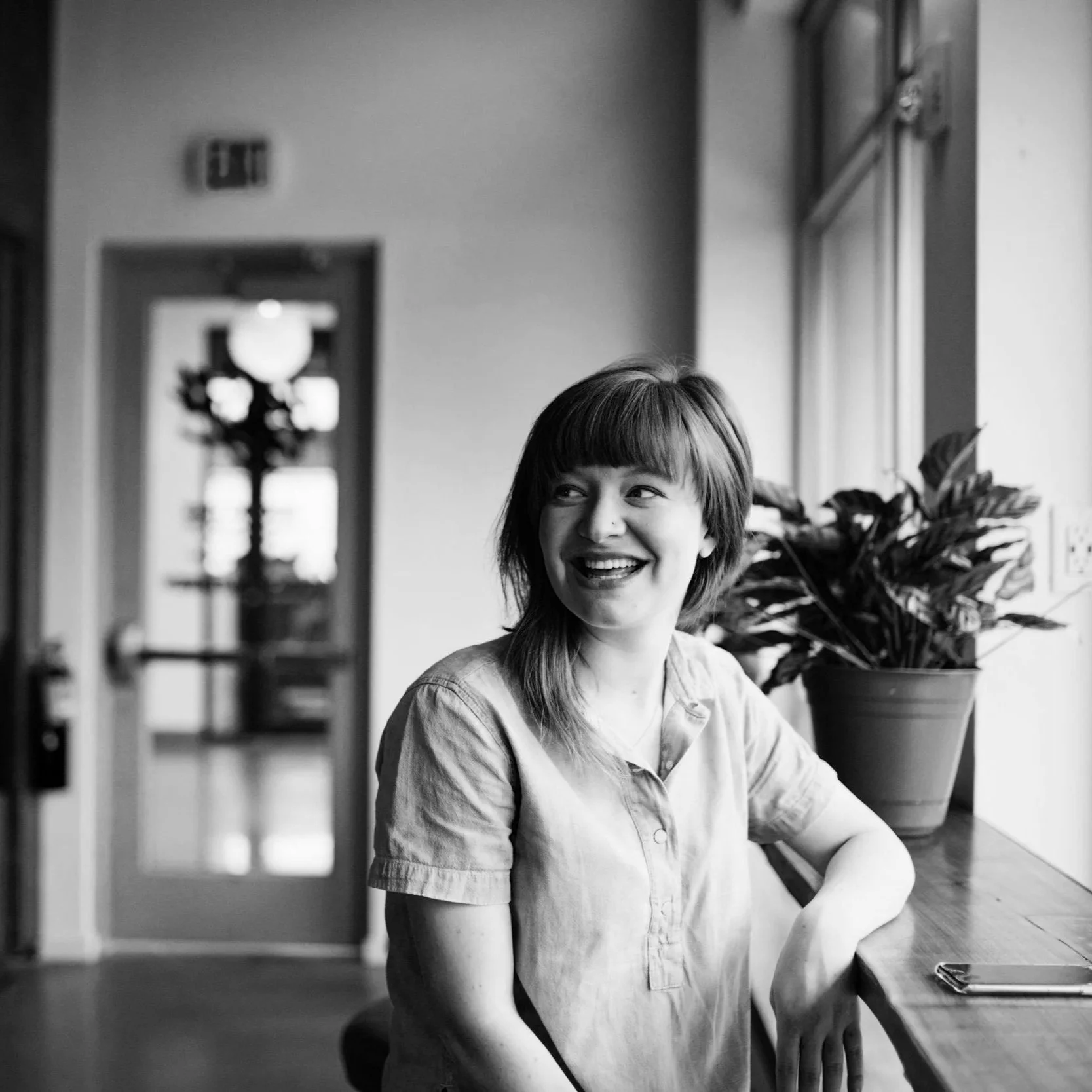 Geometric drawing of an outline square with sections divided by vertical, horizontal, and circle lines.