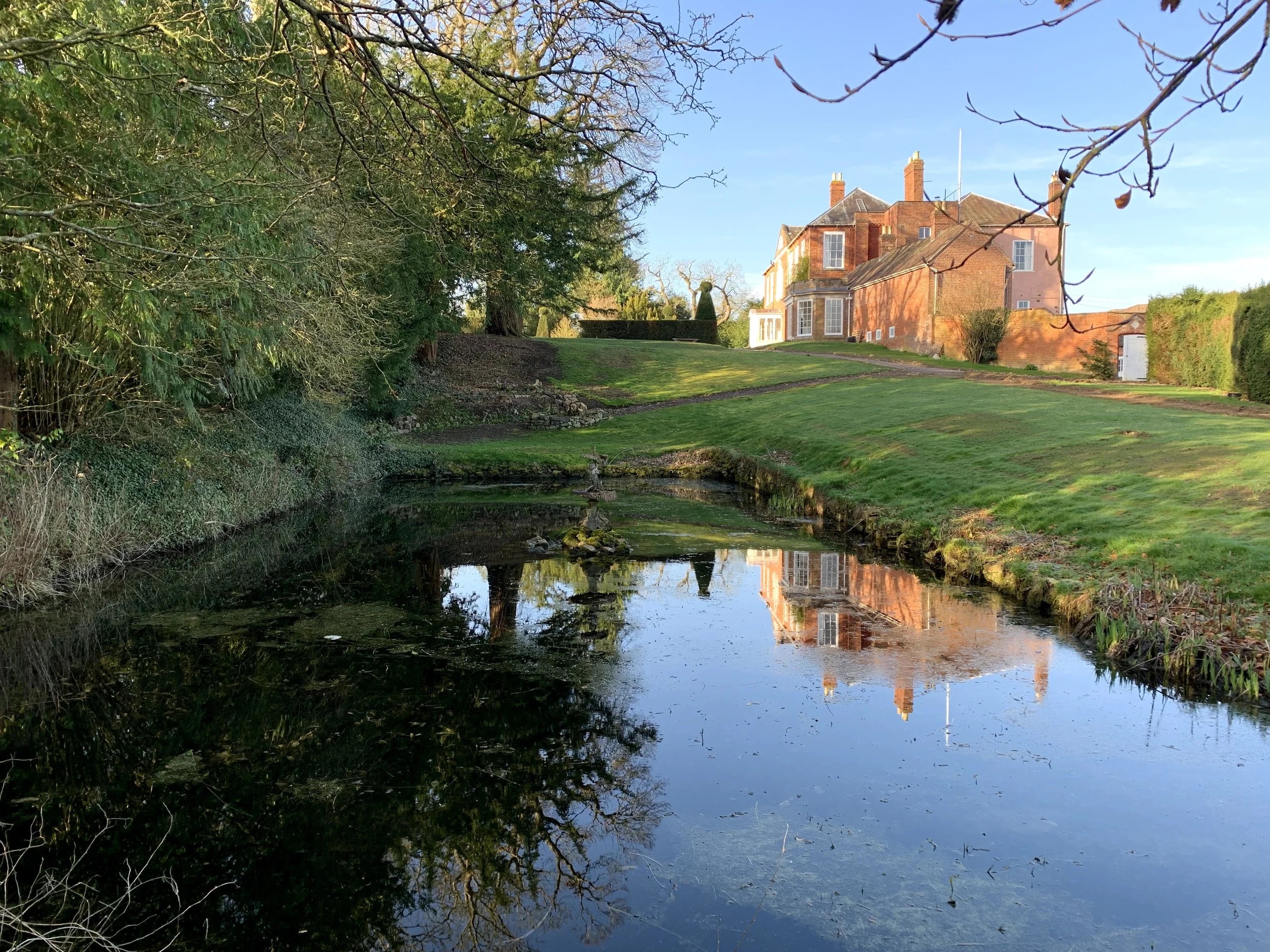 Looking towards the house from the pond at Barton Court