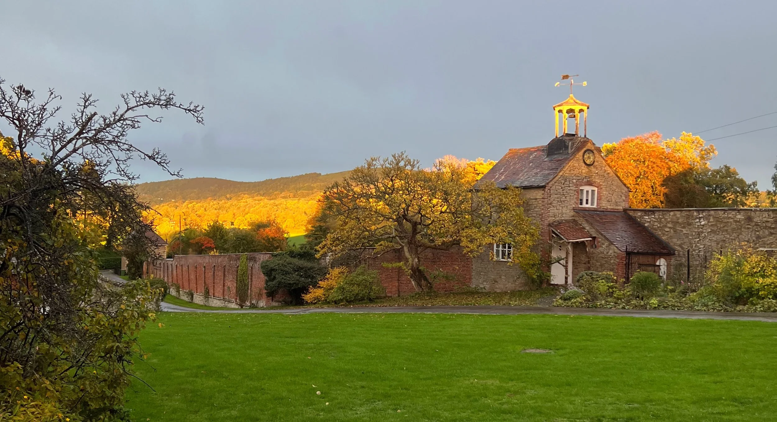Golden light on the Malvern Hills behind the Clock Tower