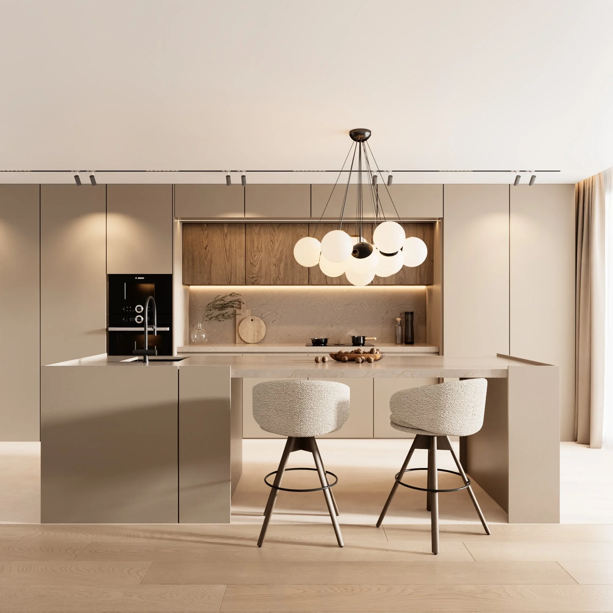 Cozinha moderna com ilha central, duas cadeiras de tecido claro, iluminação suspensa, armários de madeira e paredes claras.