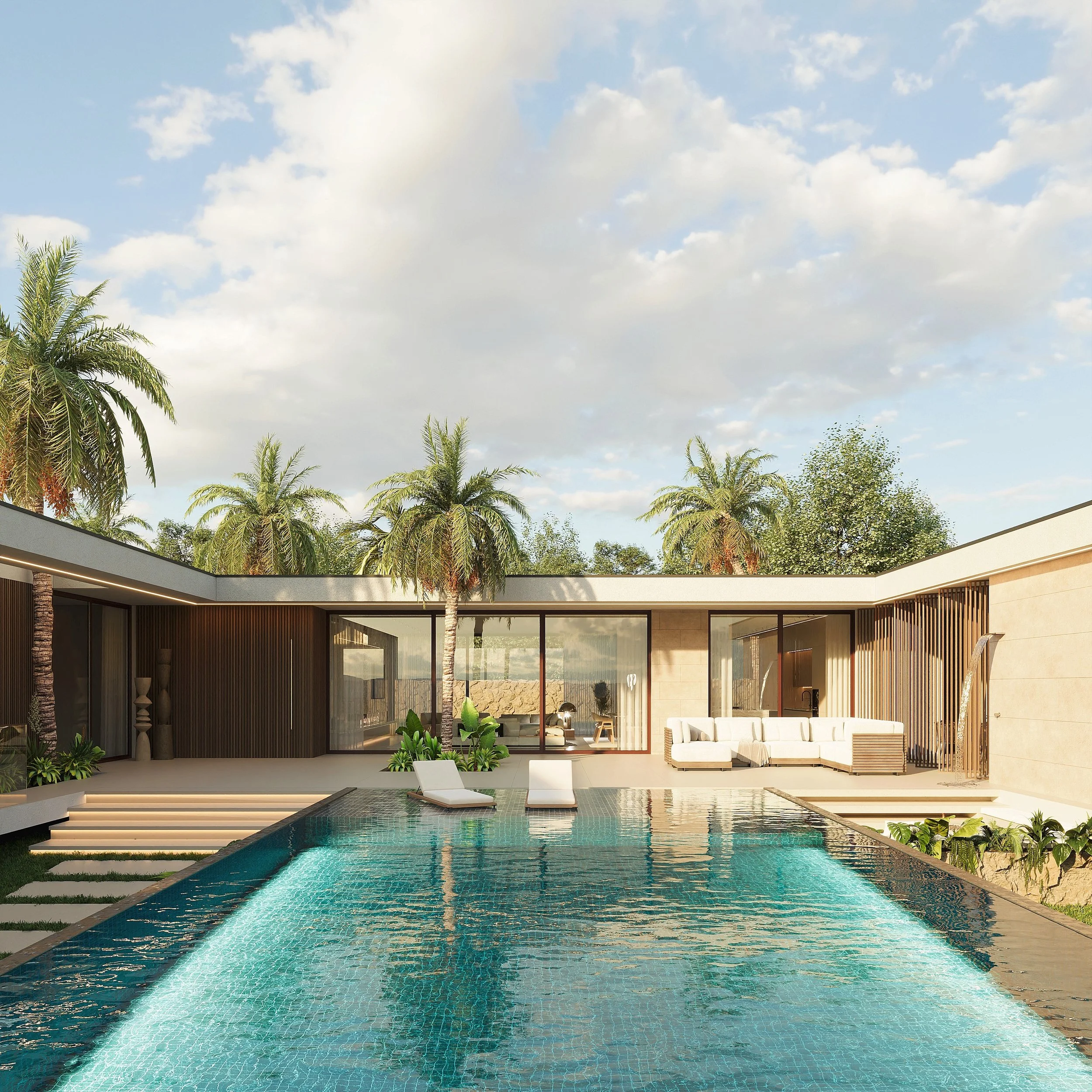 Piscina de borda infinita em frente a uma vila moderna com área de lazer ao ar livre, cercada por palmeiras e vegetação tropical, sob céu parcialmente nublado.