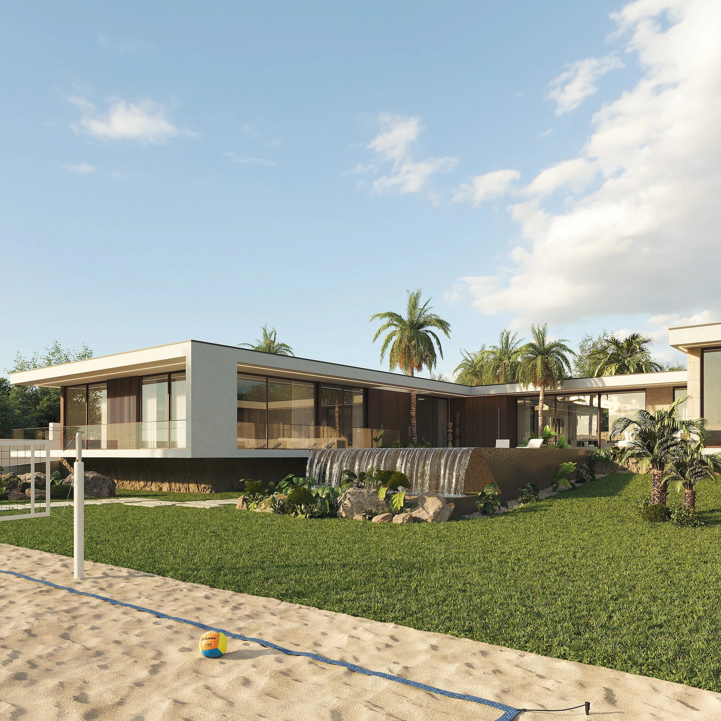 Casa moderna de arquitetura minimalista, com grande área de vidro, ao lado de uma piscina com cascata, cercada por gramado bem cuidado e algumas palmeiras ao fundo, sob céu azul com nuvens.