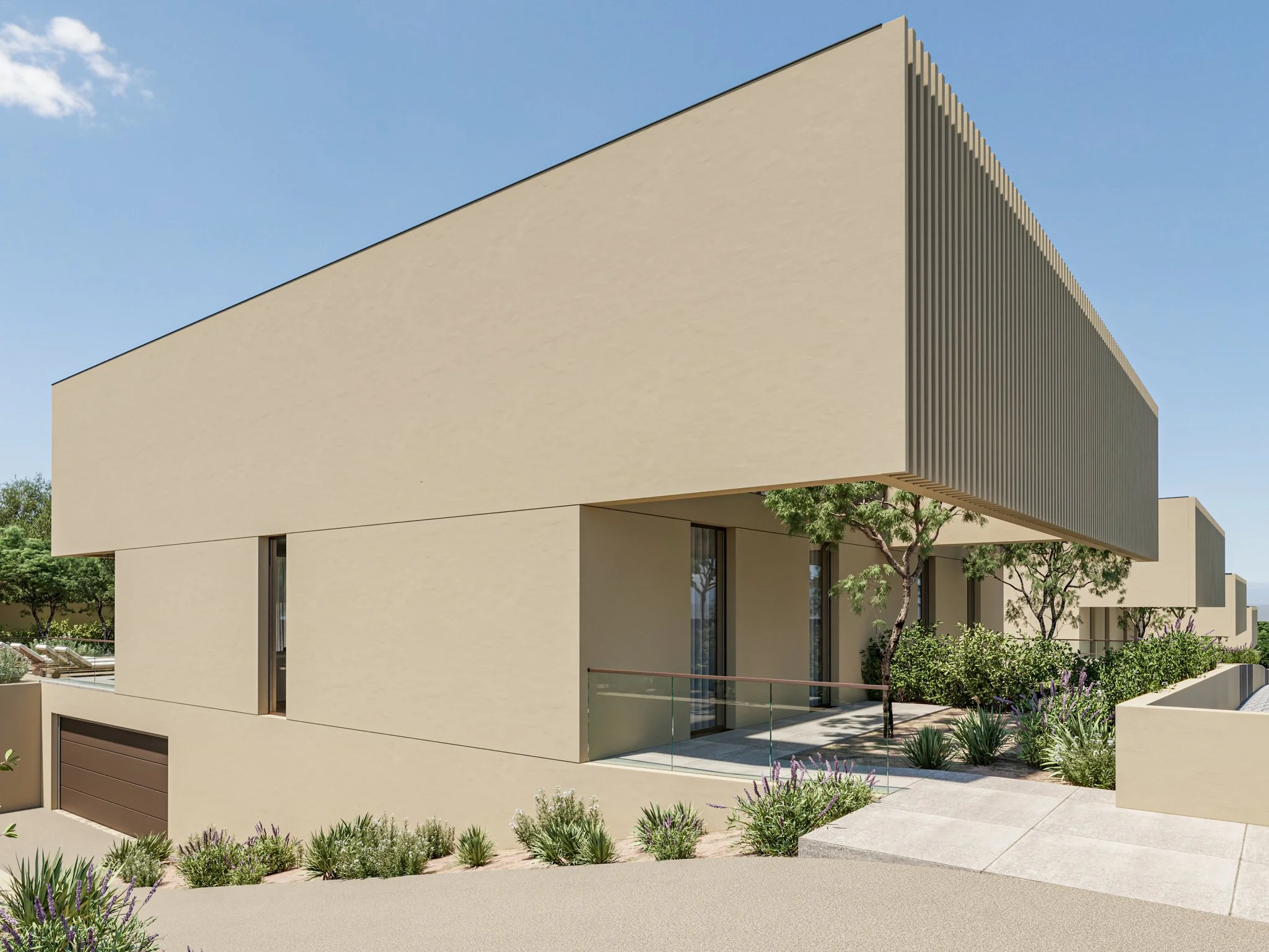 Edifício moderno com fachada bege e elementos de madeira, árvores e plantas na entrada, sob céu claro.