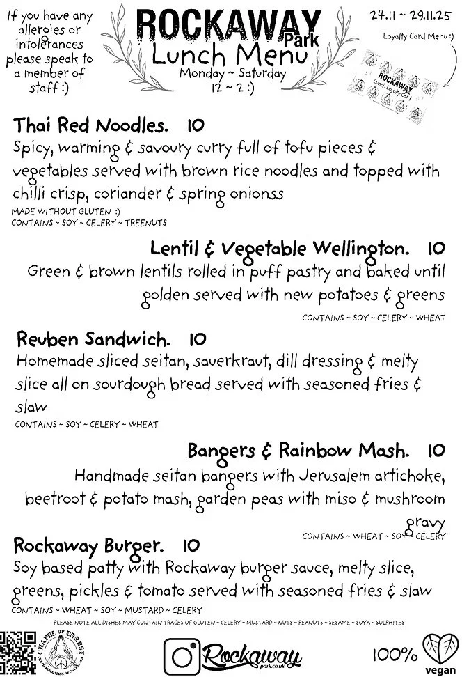 A handwritten lunch menu from Rockaway Park, listing dishes like Thai Red Noodles, Lentil & Vegetable Wellington, Reuben Sandwich, Bangers & Rainbow Mash, and Rockaway Burger, with prices and ingredient details, and a loyalty card stamp. The menu notes dietary restrictions and allergen information