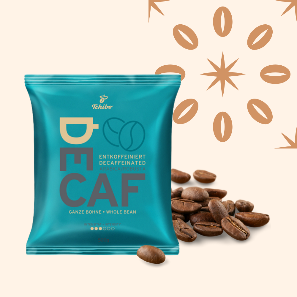 A package of decaffeinated whole bean coffee from Tchibo, with scattered coffee beans next to it and decorative coffee bean illustrations in the background.
