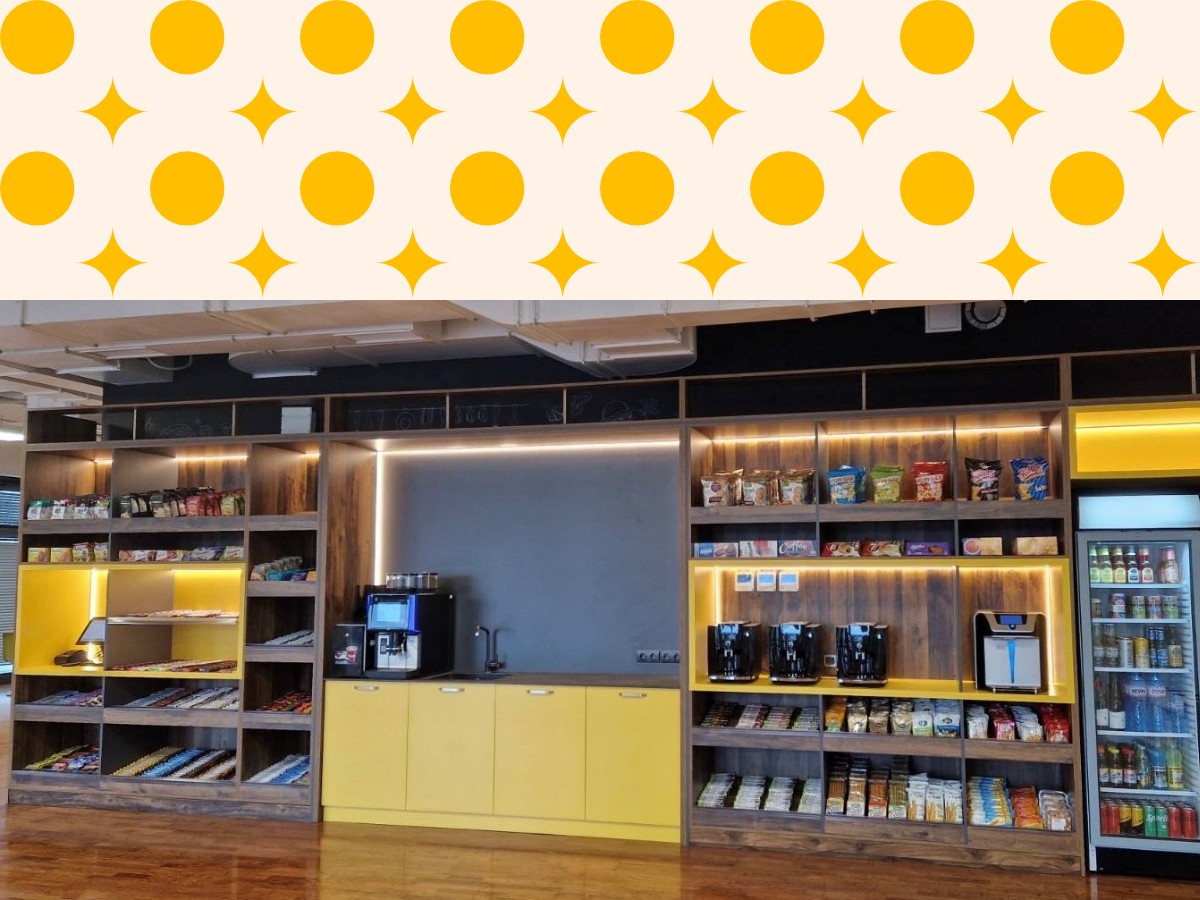 A coffee and snack station with a coffee machine, instant coffee makers, snacks, and drinks in a vending refrigerator.