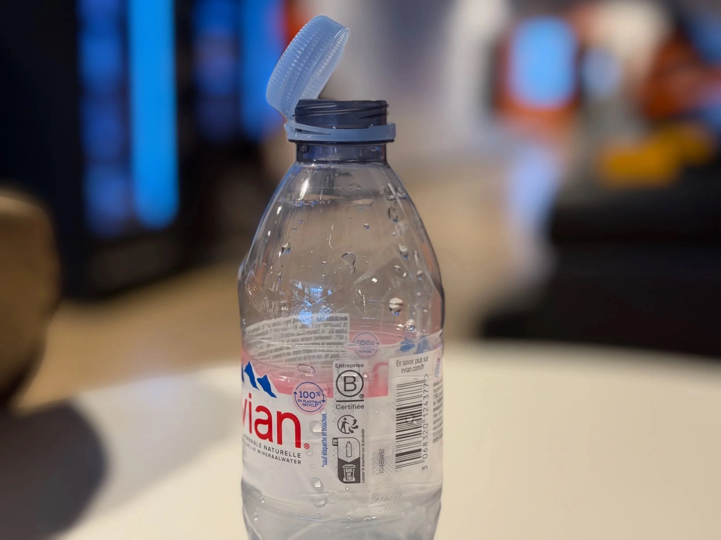 Plastic bottle with tethered bottle cap