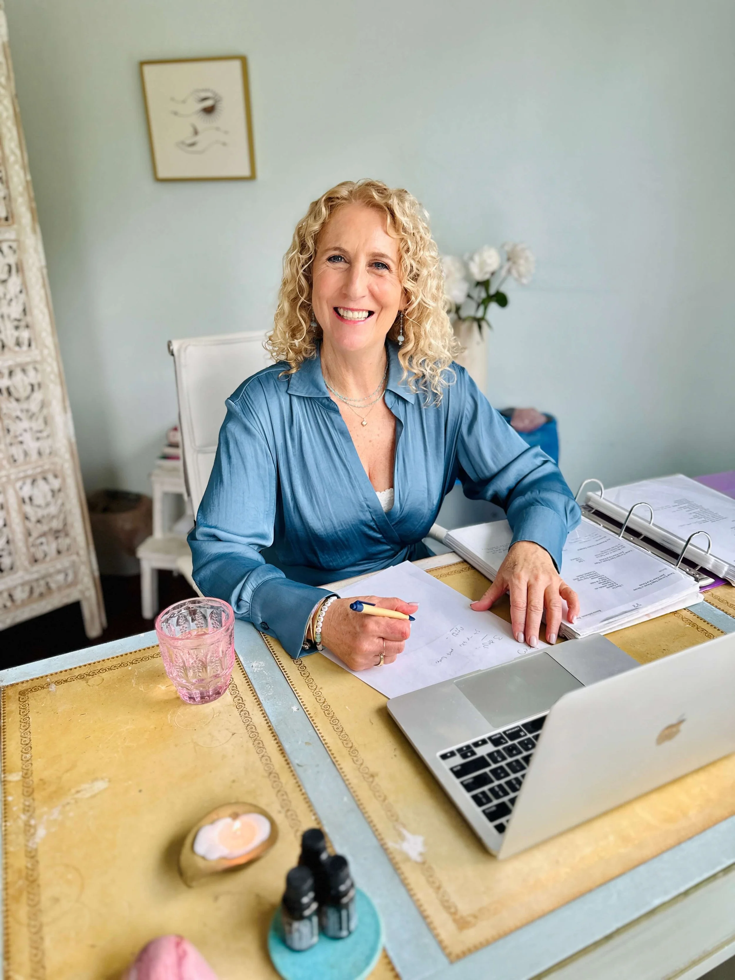 Jozi Radus at her home office, smiling and welcoming her new clients