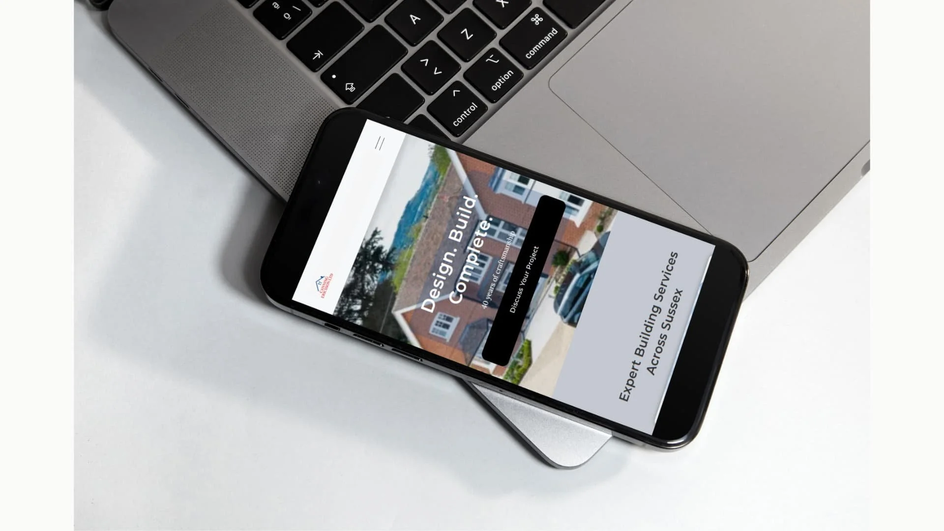 Mobile view of a building services website shown on a smartphone