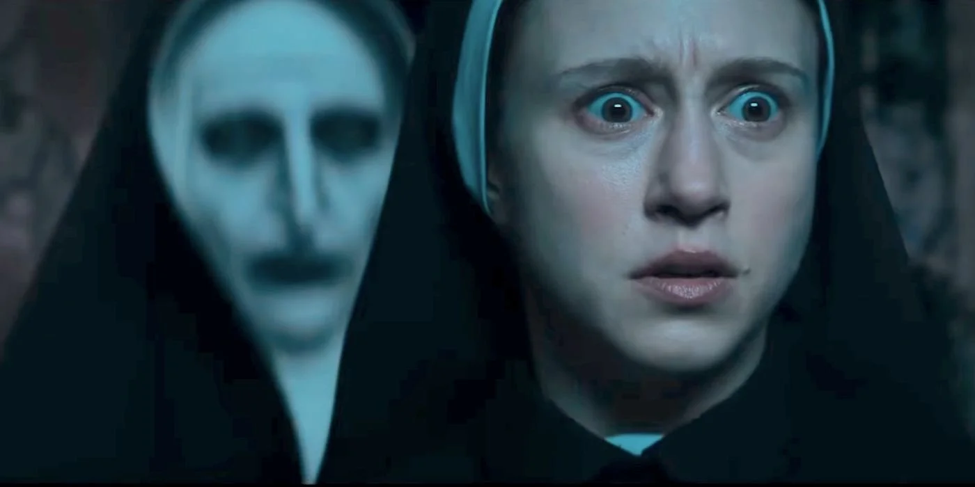 taissa-farmiga-as-sister-irene-with-valak-behind-her-in-the-nun-2.jpg