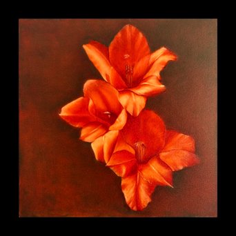 A cluster of orange and red flowers on a dark background.