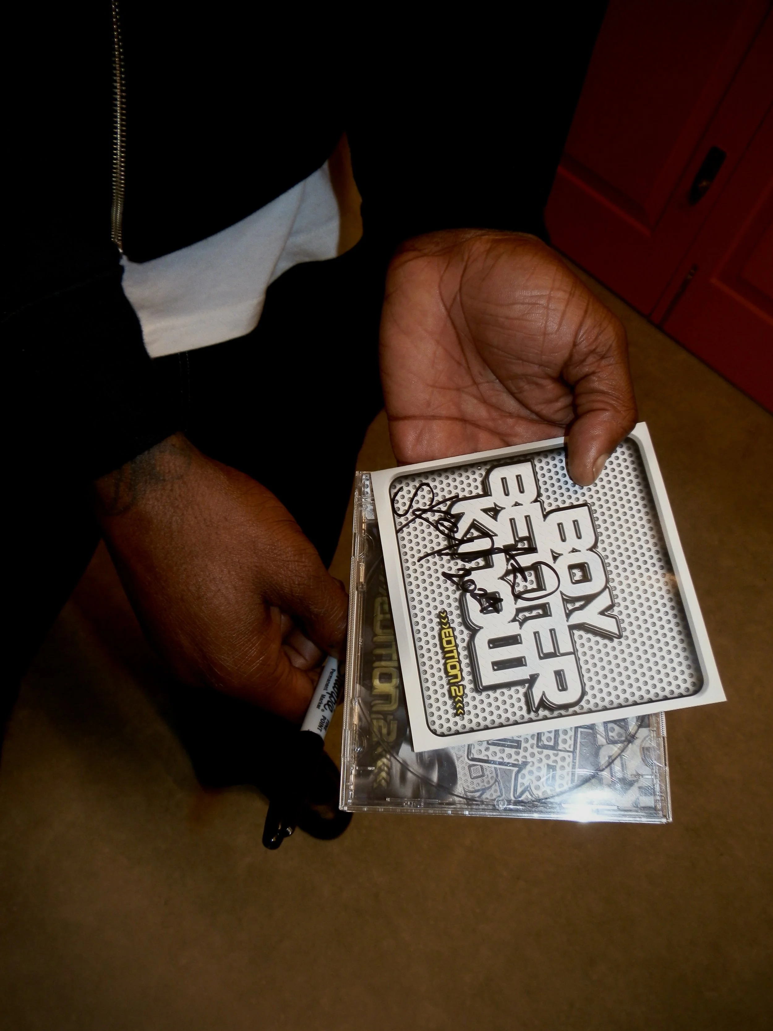 Skepta holding signed Boy Better Know edition 2 CD (Poomplex) signed