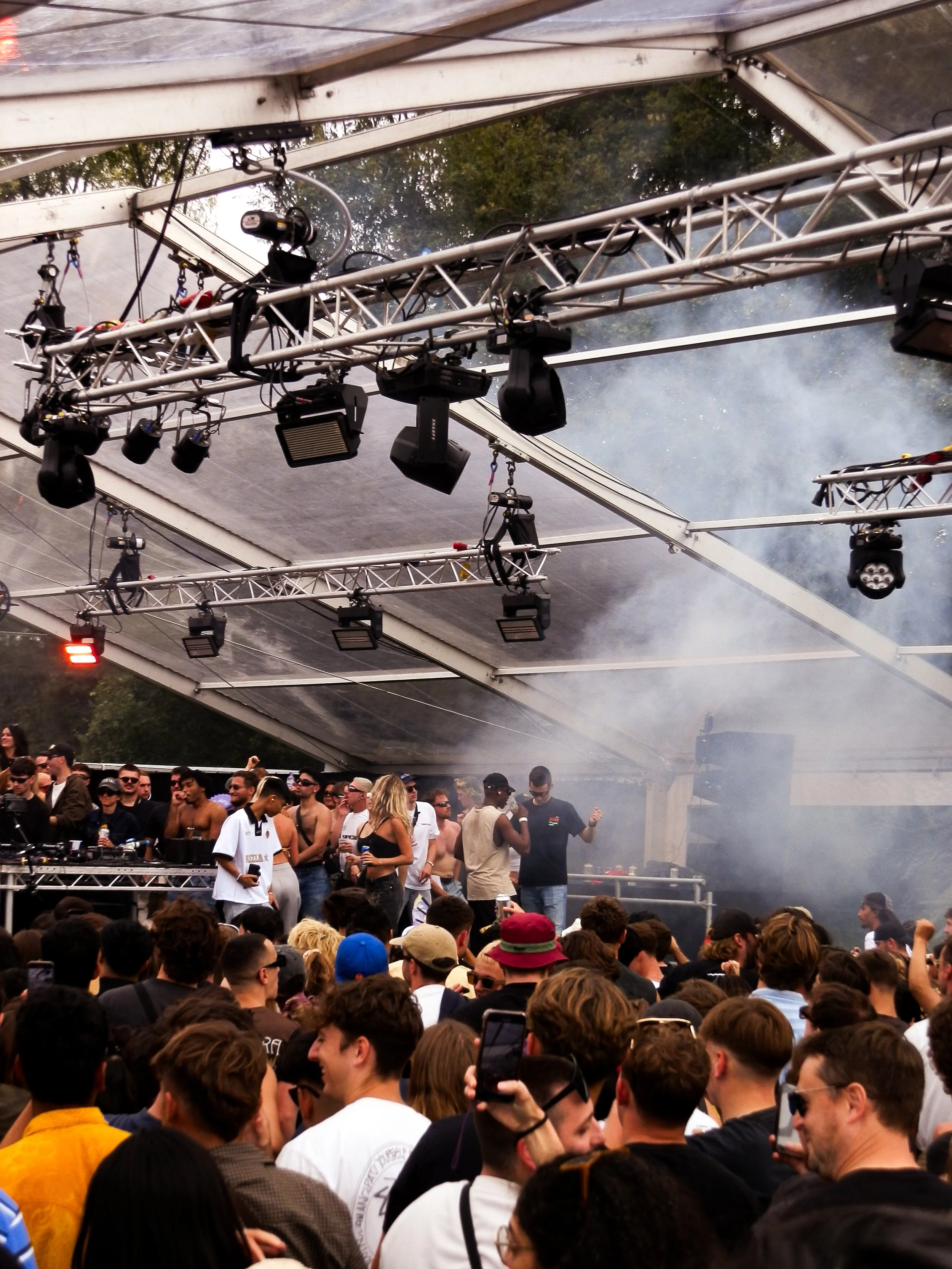 crowd photo of a festival crowd in a glass structure