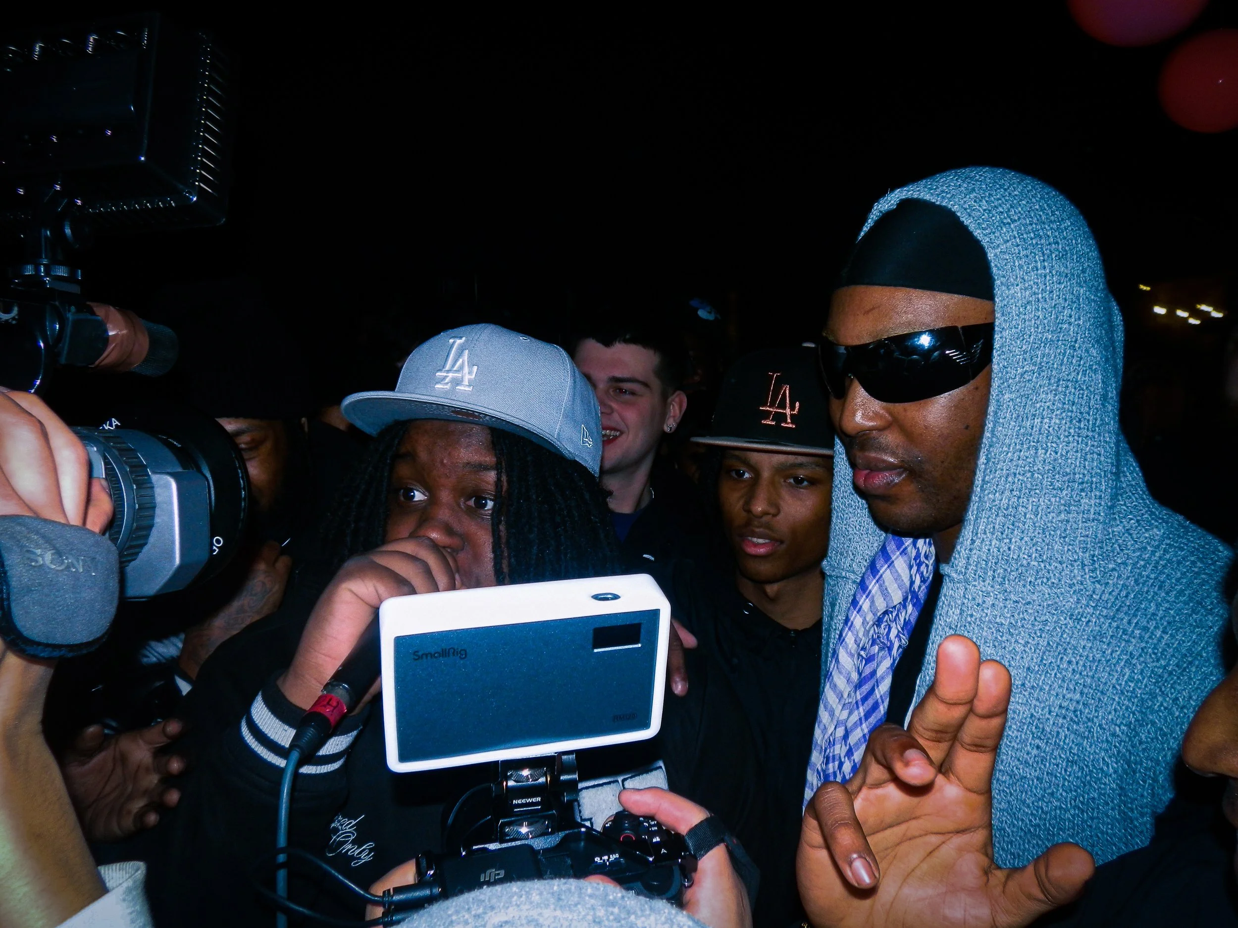 N3 mcing into a mic and cam corder in the middle of a crowd at travsprevents grime rave 