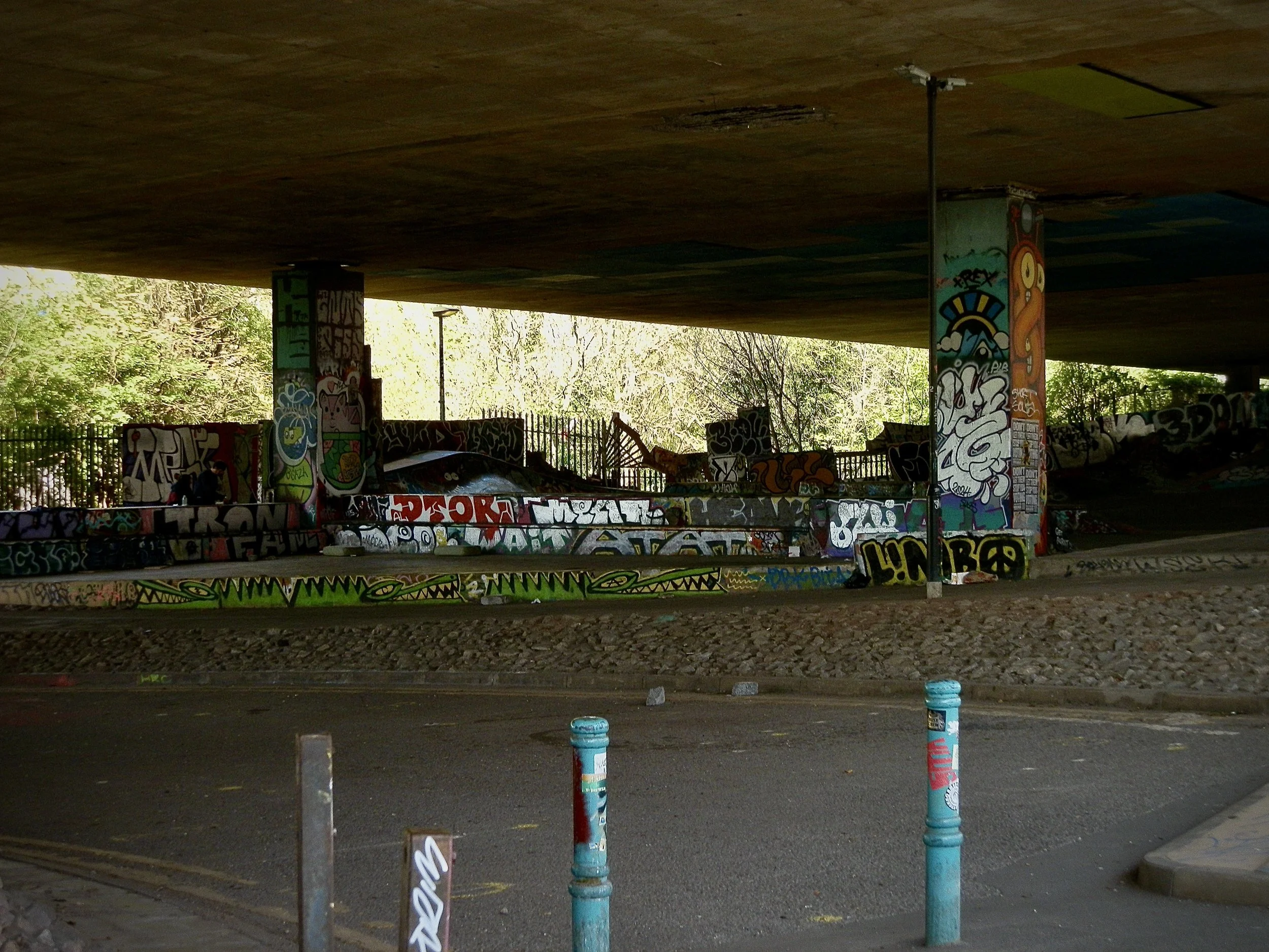 a skatepark with bright colourful graffiti 